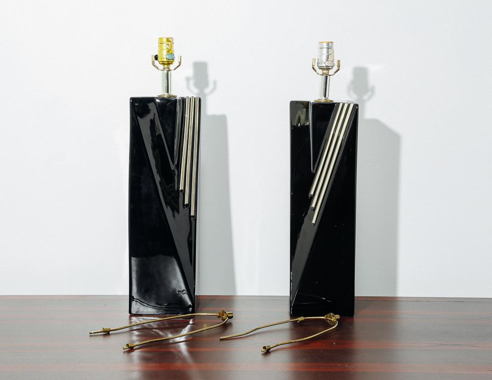 1980s table lamps with high gloss black ceramic bases and gold brass accents. No shades included.