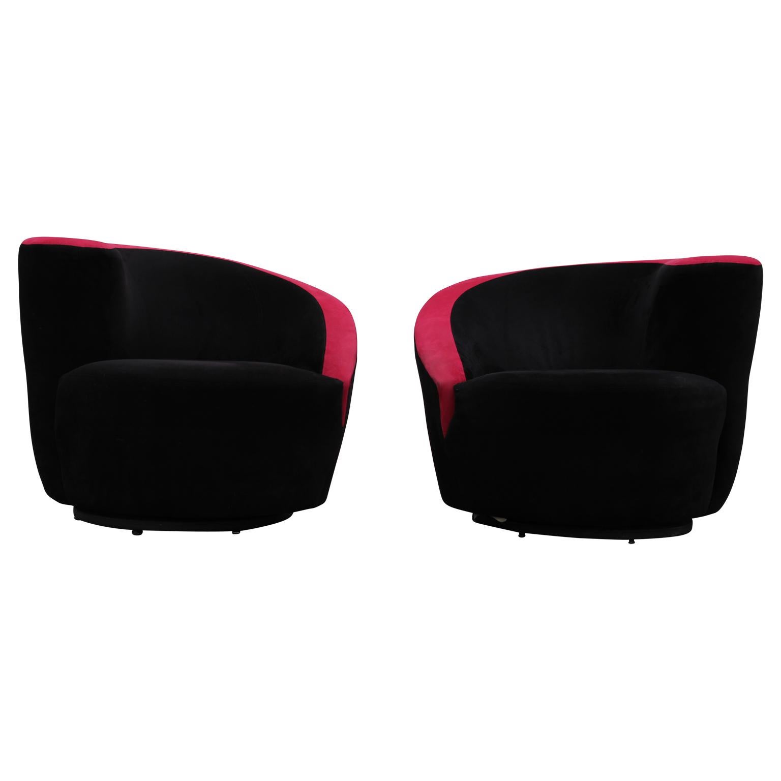 Beautiful sculptural black and red corkscrew lounge chairs that perfectly mirror each other. The swivel chairs have a unique asymmetrical design with a curved, swooping back line that makes the perfect comfortable lounge chair. Reupholstering the