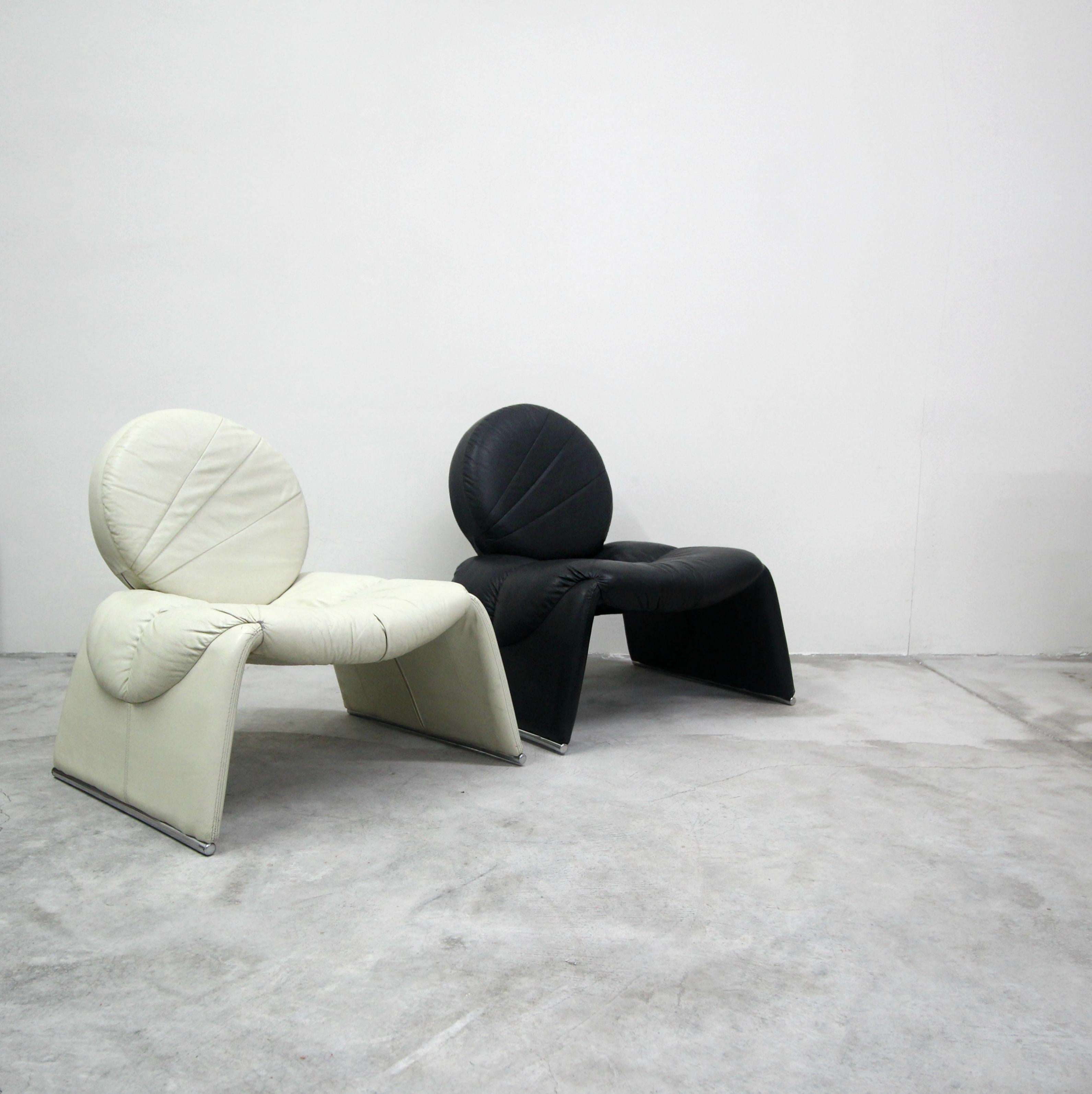 Black and white never looked so good. This pair of black and white leather vintage Italian lounge chairs are incredible. Similar is style to the Proposals chair by Vittorio Introini for Saporiti, but better. A very, very rare and unique
