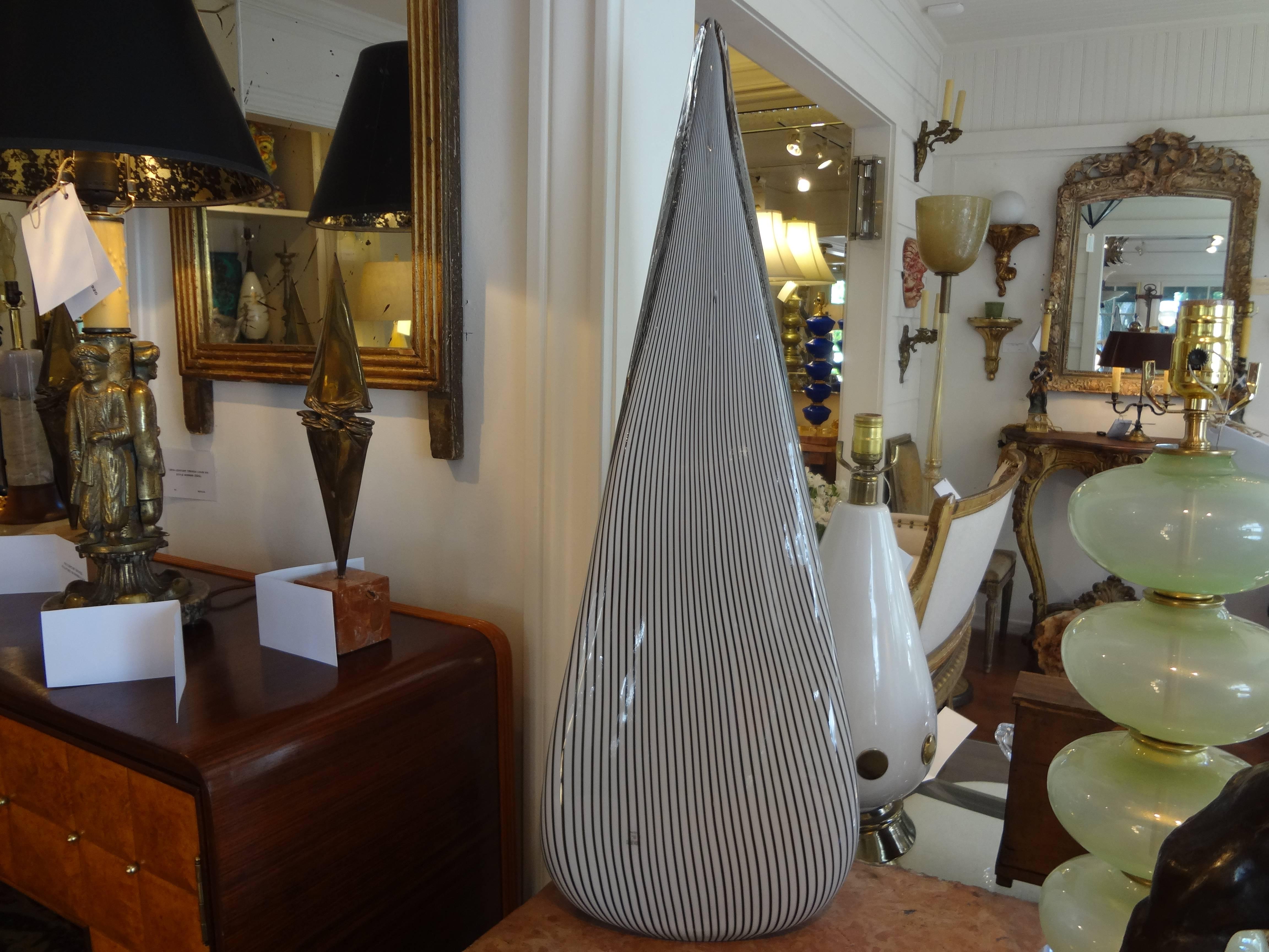 Pair of Murano glass lamps by Vetri.
Large pair of Postmodern Murano glass pyramid or triangular shaped lamps. This unusual and rare pair of Italian lamps was manufactured by Vetri, Murano in the 1970s. These Venetian glass table lamps have a black