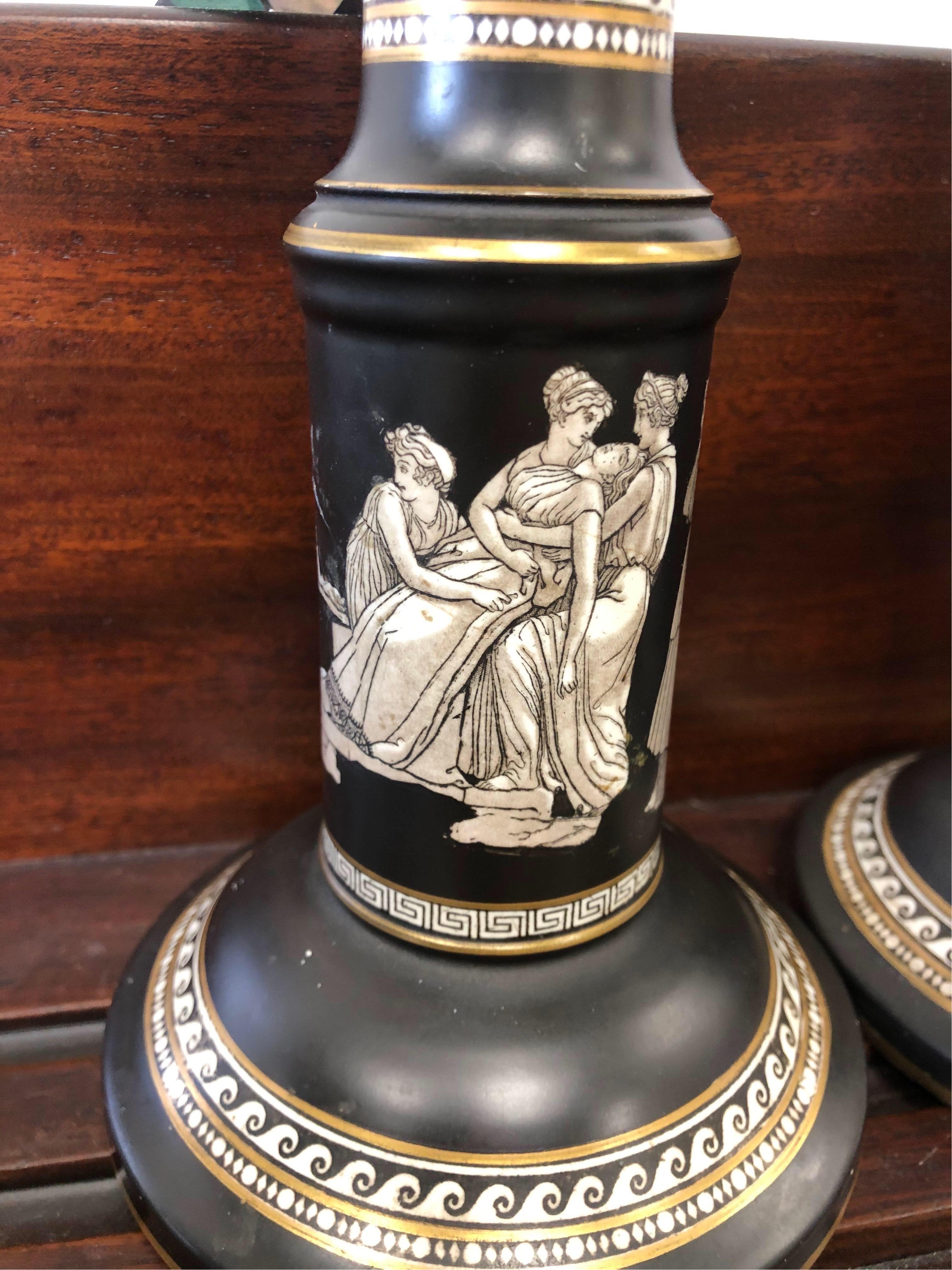 Neoclassical-style Prattware black and white pottery candlesticks with classical figures marked 