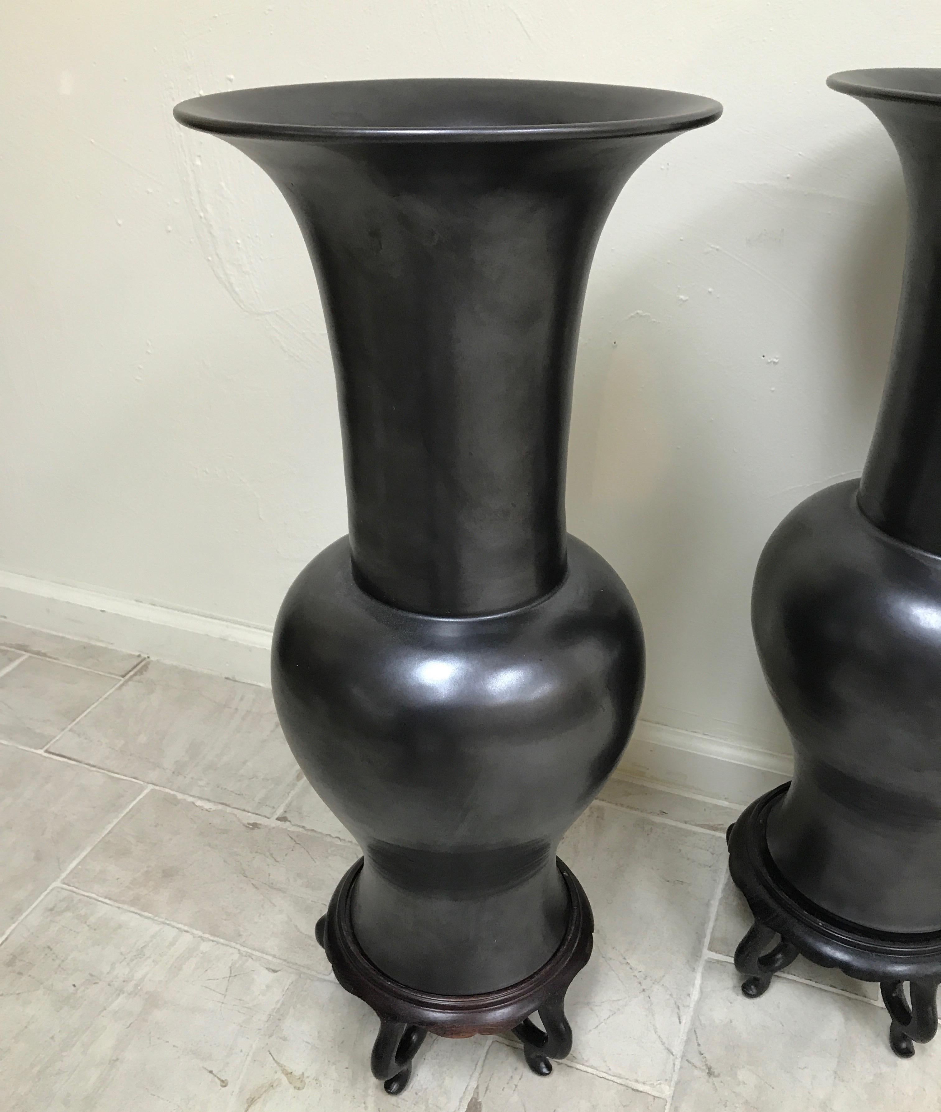 Ceramic Pair of Black Basalt Temple Vases on Wood Stands For Sale