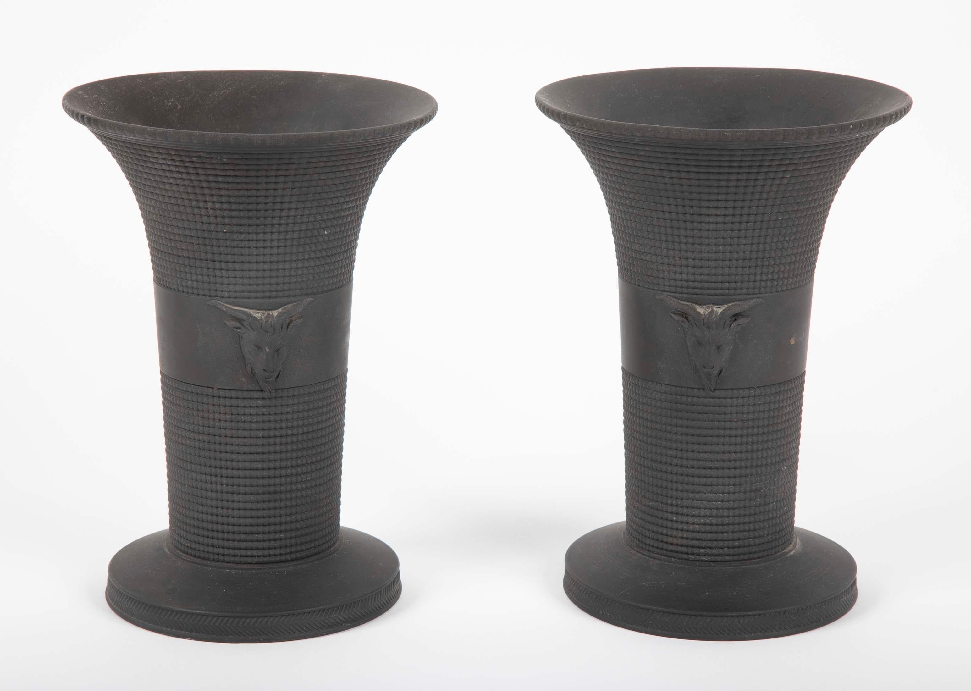 A pair Wedgewood vases in black basalt with applied goat heads and impressed on base 