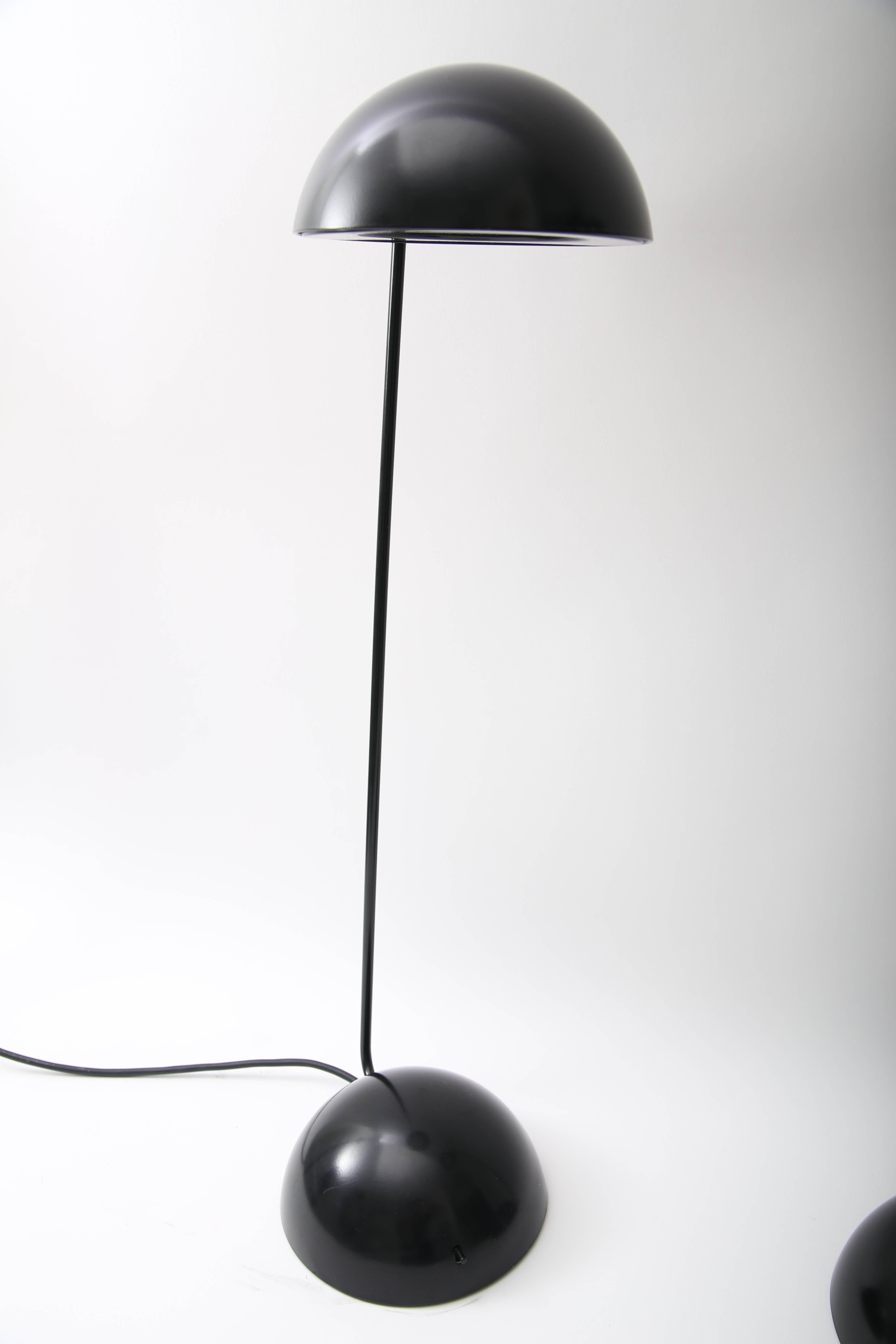 This pair of black table lamps were created by Barbieri & Marinelli for Thonconi and are known as the 