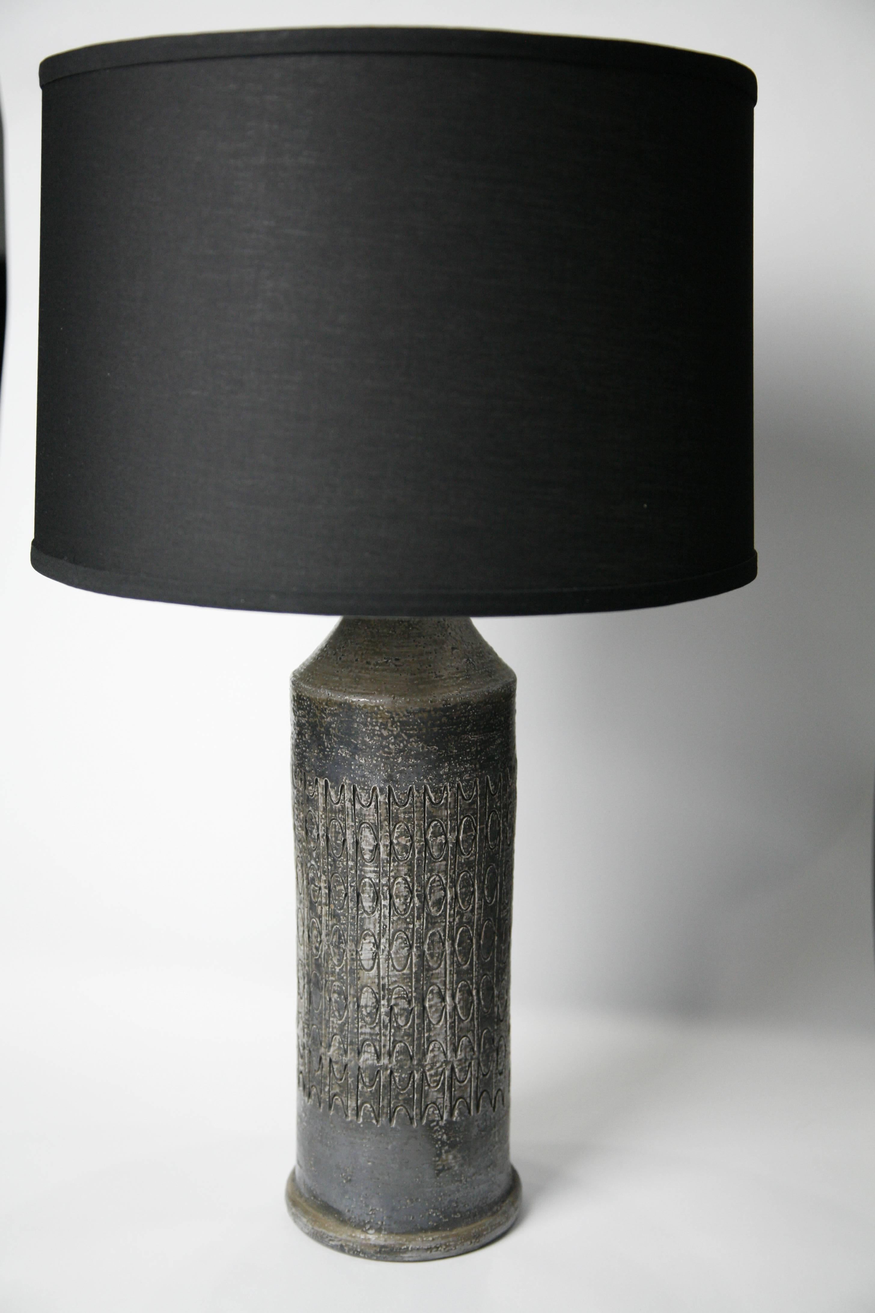 Bitossi lamps Italy 1970s ceramic in a black and silver multi layered glaze.
Swanky totally out of time pair of dark Italian ceramic lamps from 1960s could as well have been part of the Blade runner movie interiors by Designer multi artist Aldo