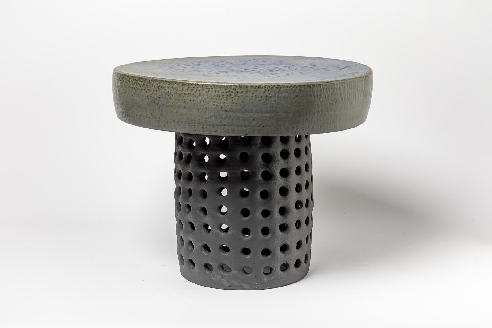 Pair of black/blue and grey/green glazed ceramic stool or coffee table by Mia Jensen. 
Artist signature under the base. 2023.
H : 16.3’ x 19.9’ inches.