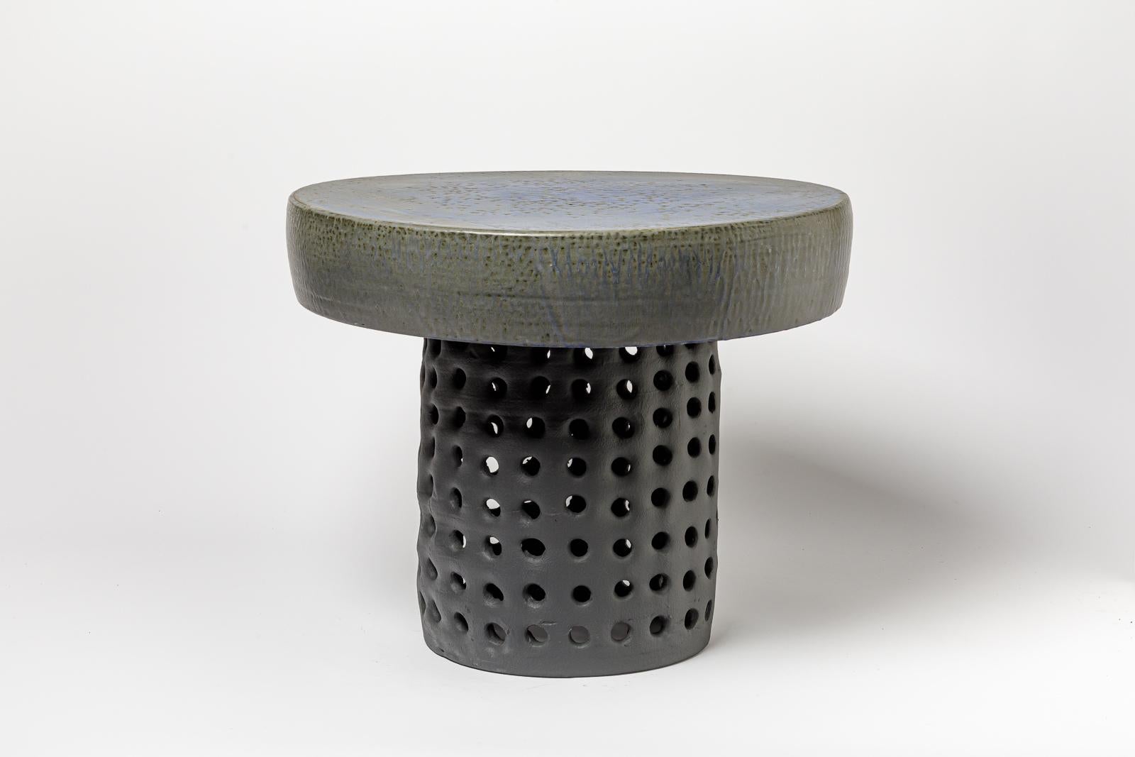 Beaux Arts Pair of black/blue and grey/green glazed ceramic stool or coffee table
