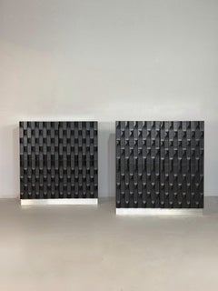Pair of Black brutalist cabinets with graphic door panels, 1970s