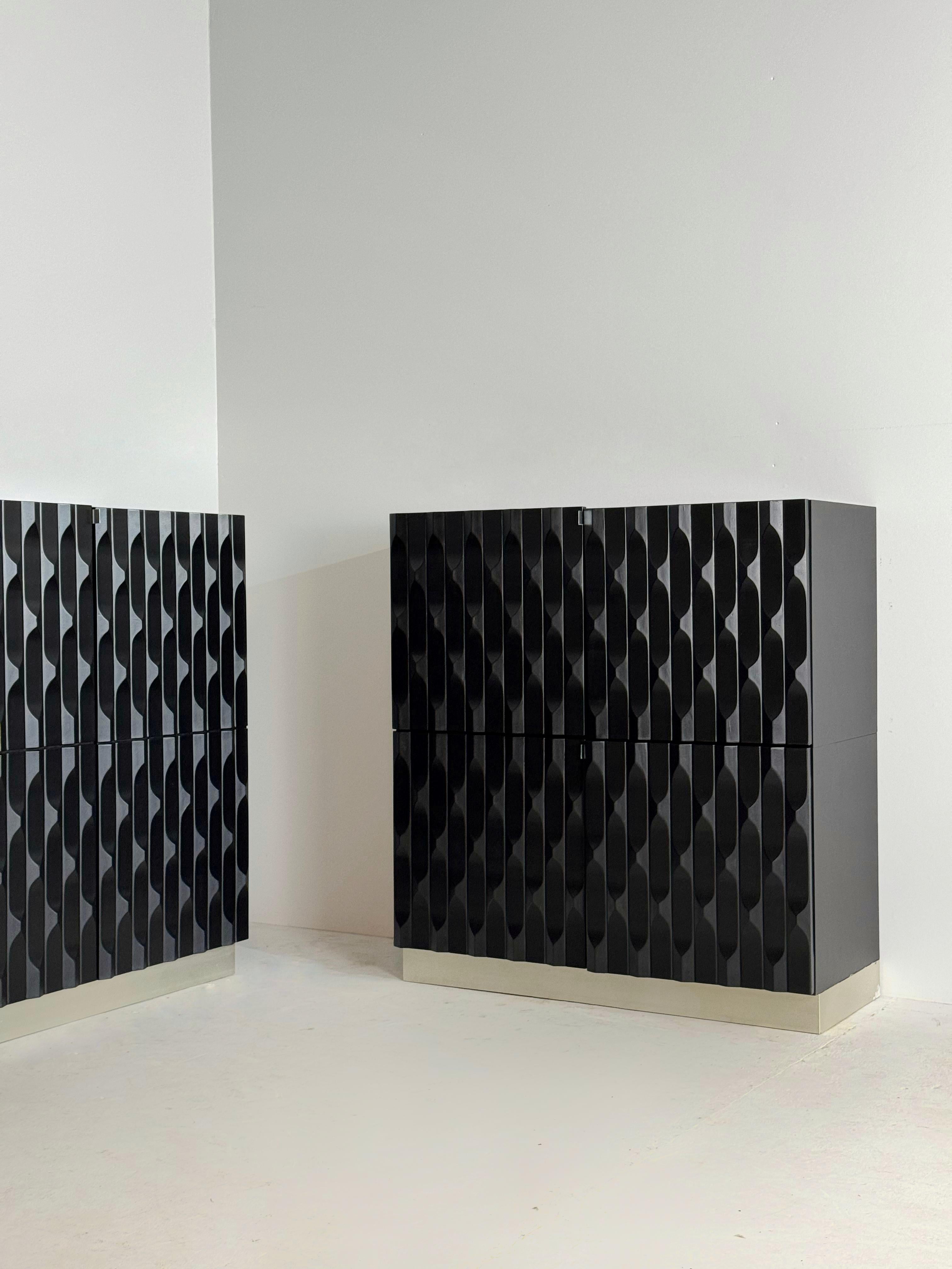 European Pair of Black brutalist cabinets with graphic door panels, 1970s For Sale