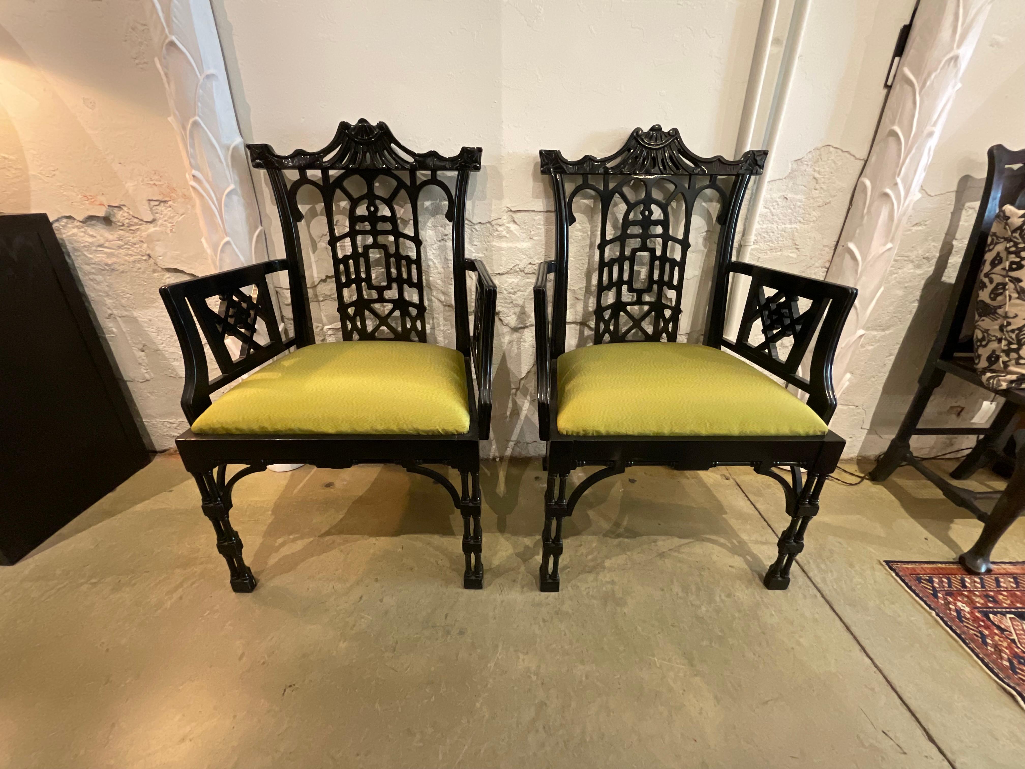 A pair of black 1970's Chinese Chippendale Dining Arm Chairs with green inset seat cushions. black finish in good shape and chairs are sound and solid. 