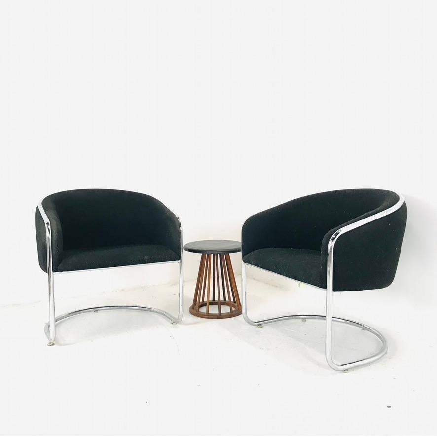 Pair of Mid-Century Modern tubular chrome accent chairs by Thonet. These are structurally sound and in good condition, with some minor patina on the chrome.