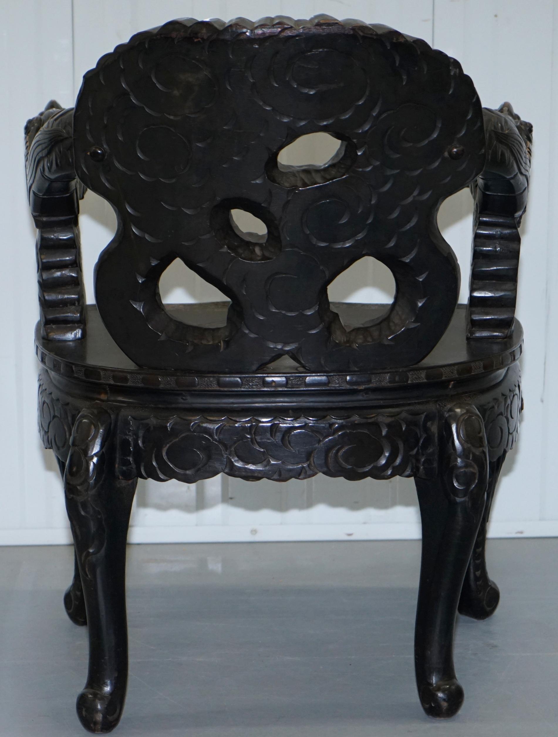 Pair of Black Qing Dynasty Carved Dragon and Lion Foo Dogs Armchairs, circa 1870 3