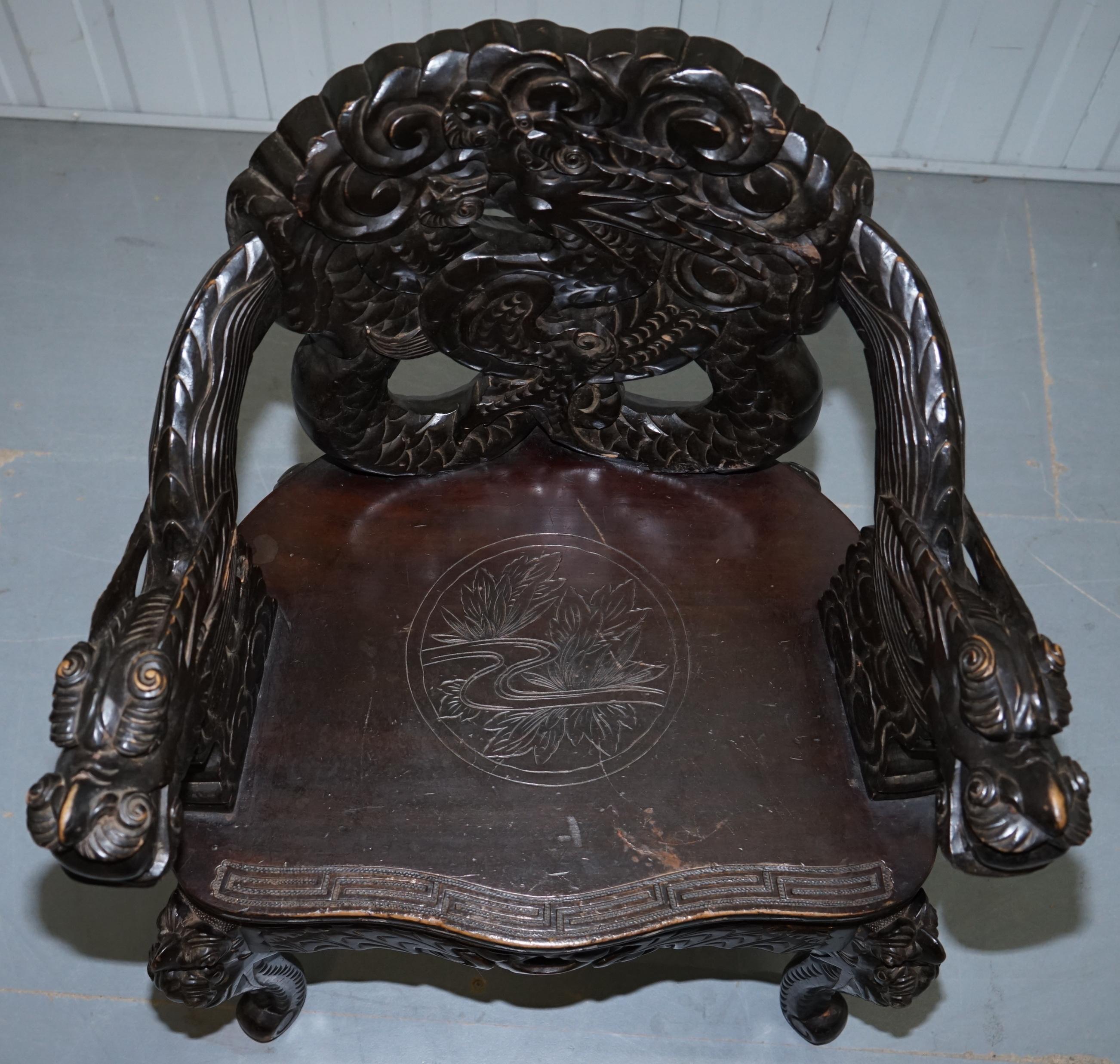Pair of Black Qing Dynasty Carved Dragon and Lion Foo Dogs Armchairs, circa 1870 9