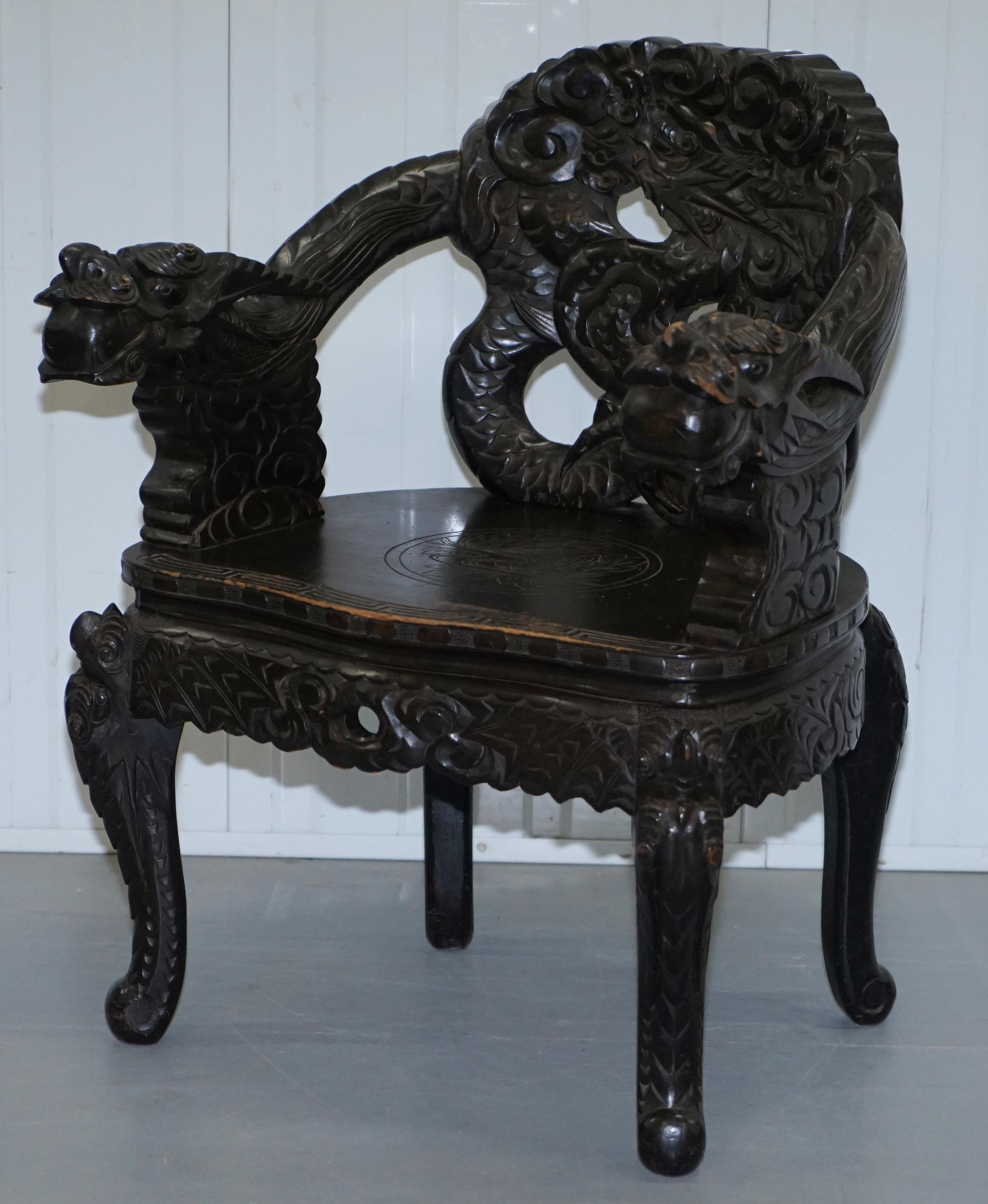 Hand-Carved Pair of Black Qing Dynasty Carved Dragon and Lion Foo Dogs Armchairs, circa 1870