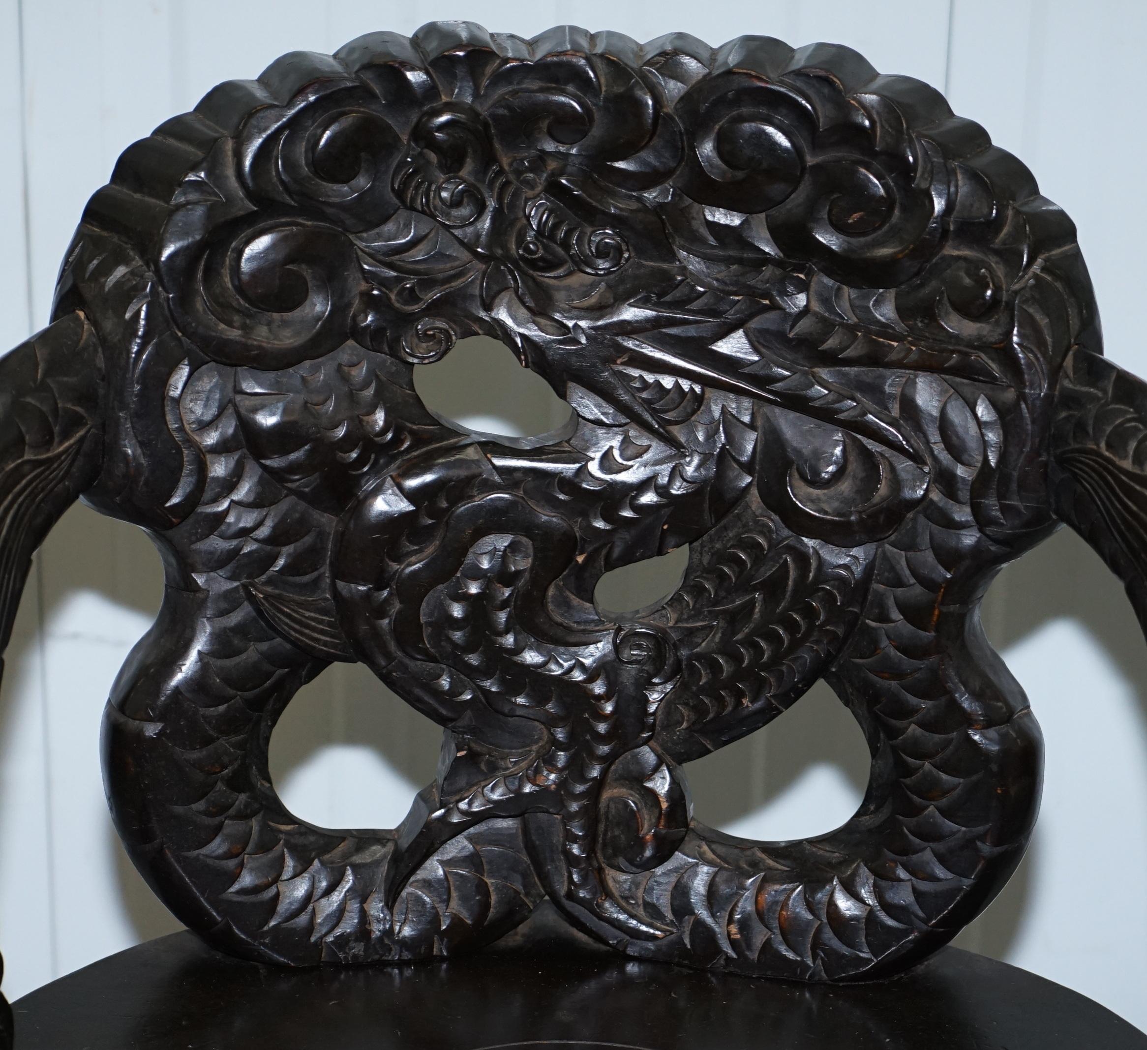 Late 19th Century Pair of Black Qing Dynasty Carved Dragon and Lion Foo Dogs Armchairs, circa 1870