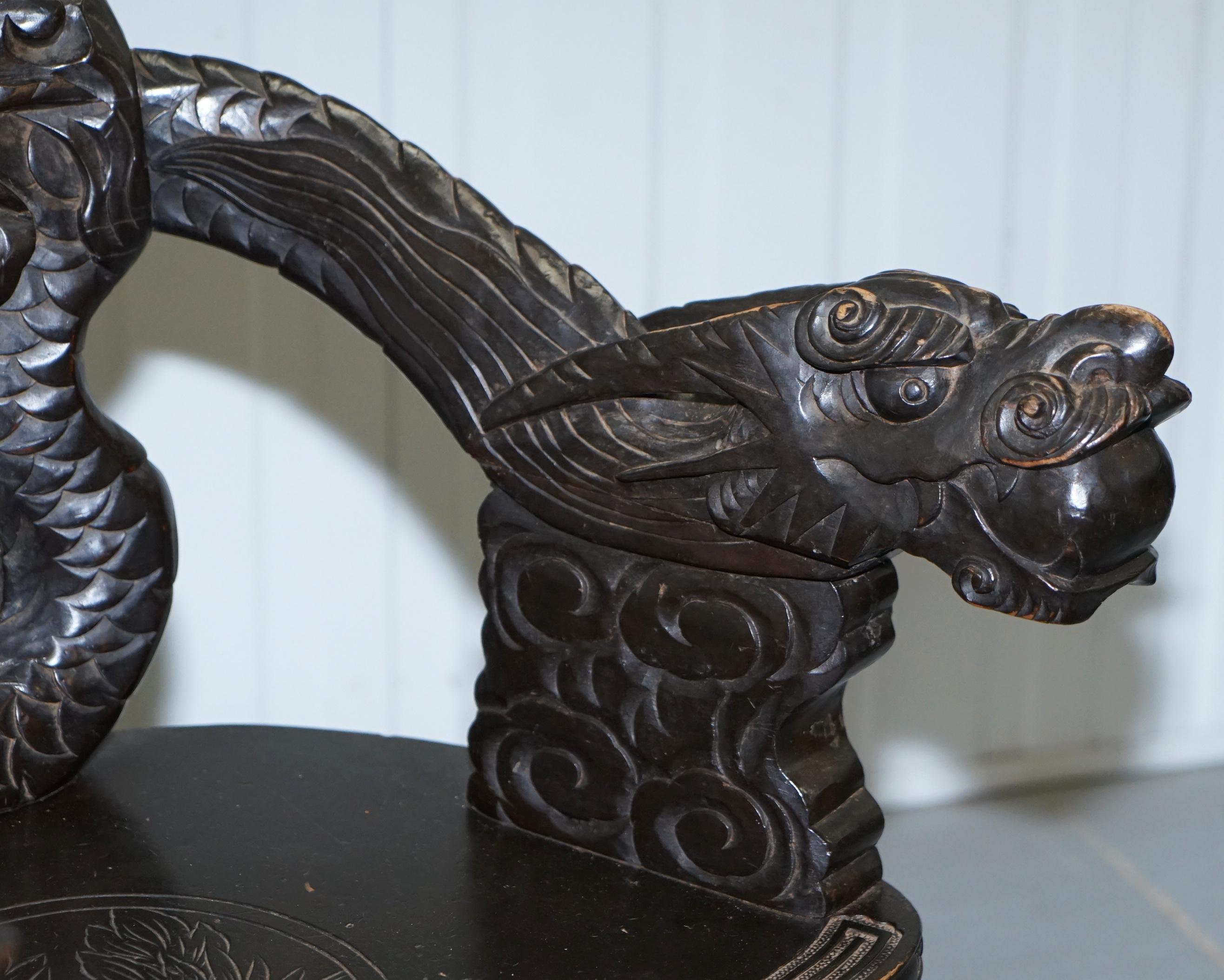 Pair of Black Qing Dynasty Carved Dragon and Lion Foo Dogs Armchairs, circa 1870 1