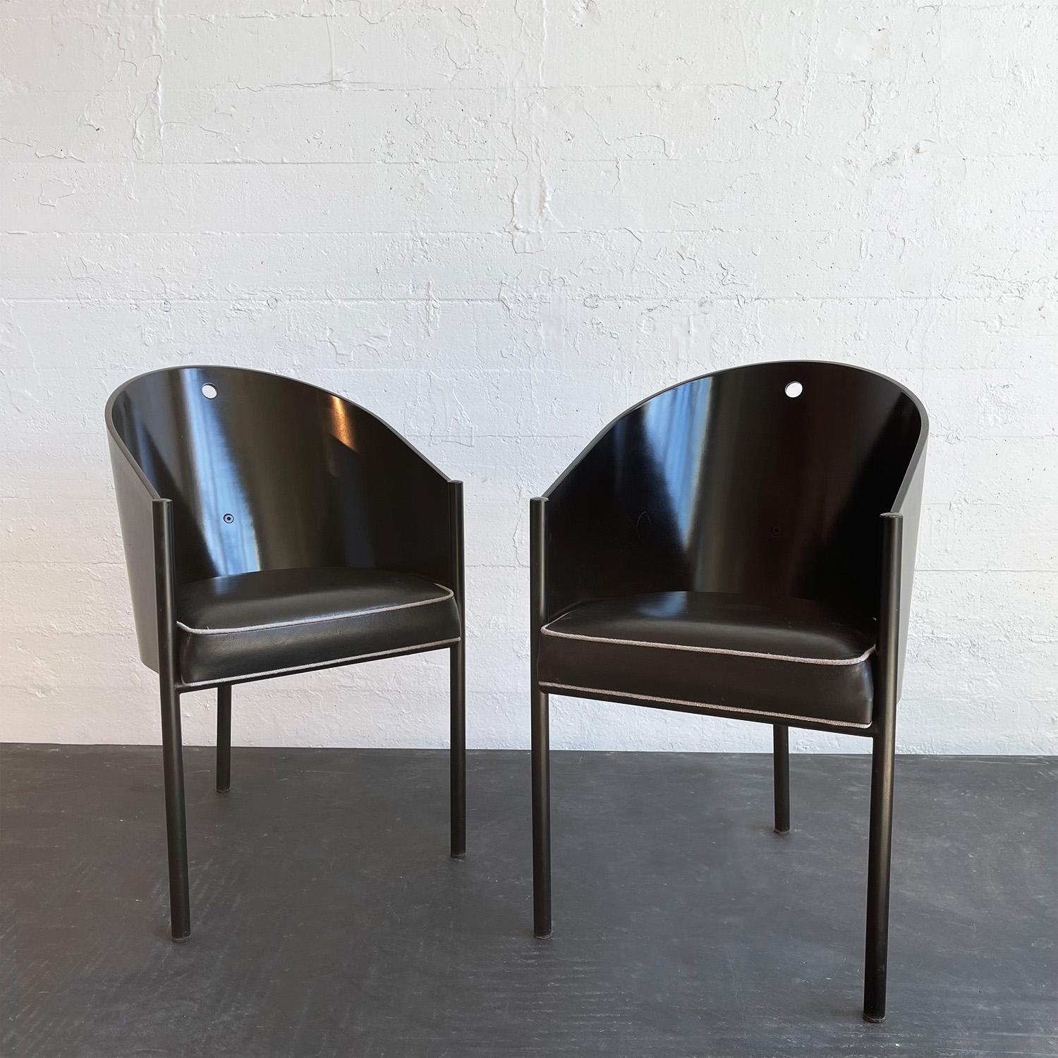 This pair of sleek, Costes chairs by French designer and architect Philippe Starck for Driade, Italy was designed for the Costes Cafe in Paris. The chair's barrel shell is made of black lacquered plywood that rests on three black-painted, tubular,