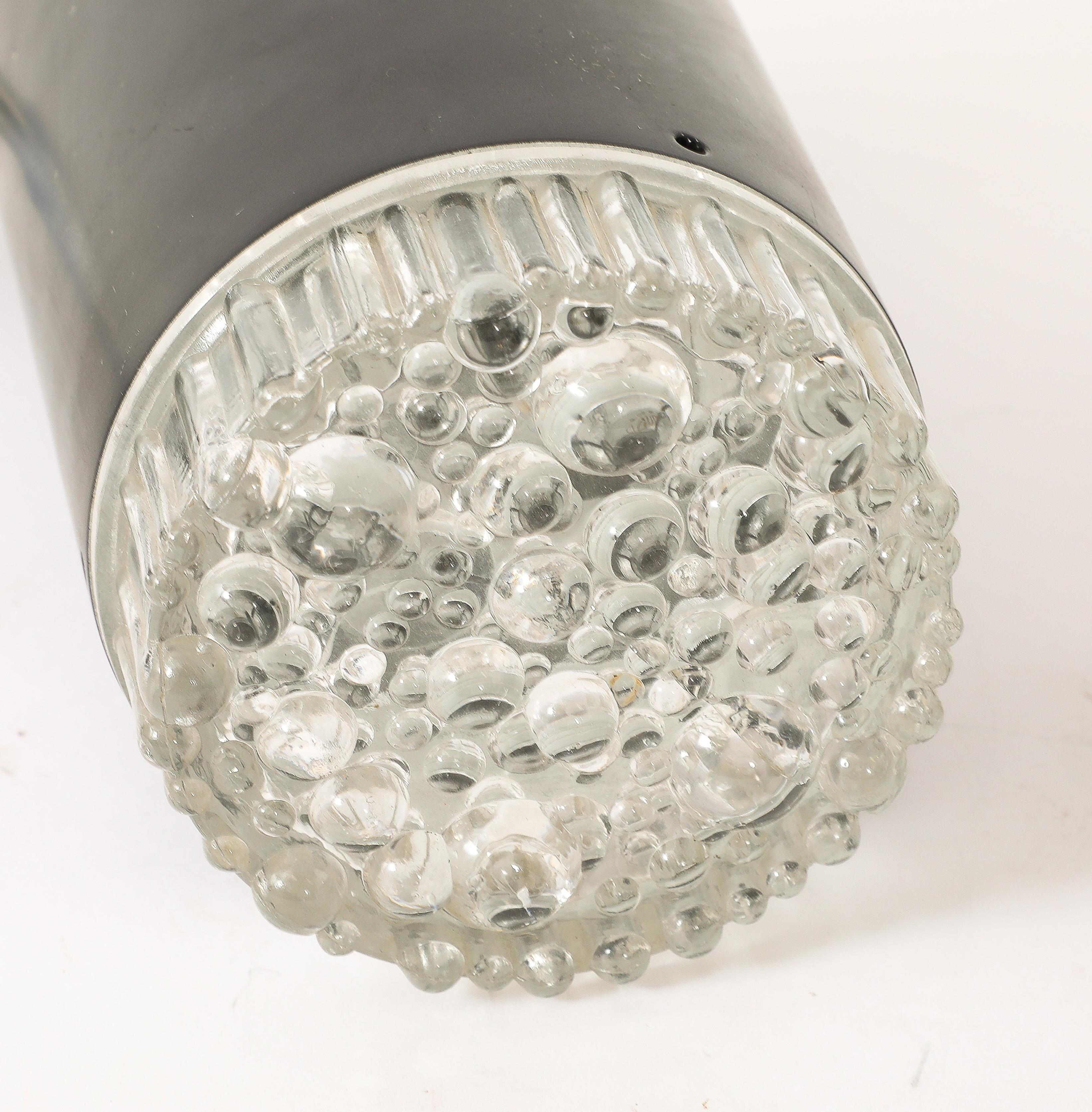 Large aluminum sconces with cast glass lenses.
France 1950s