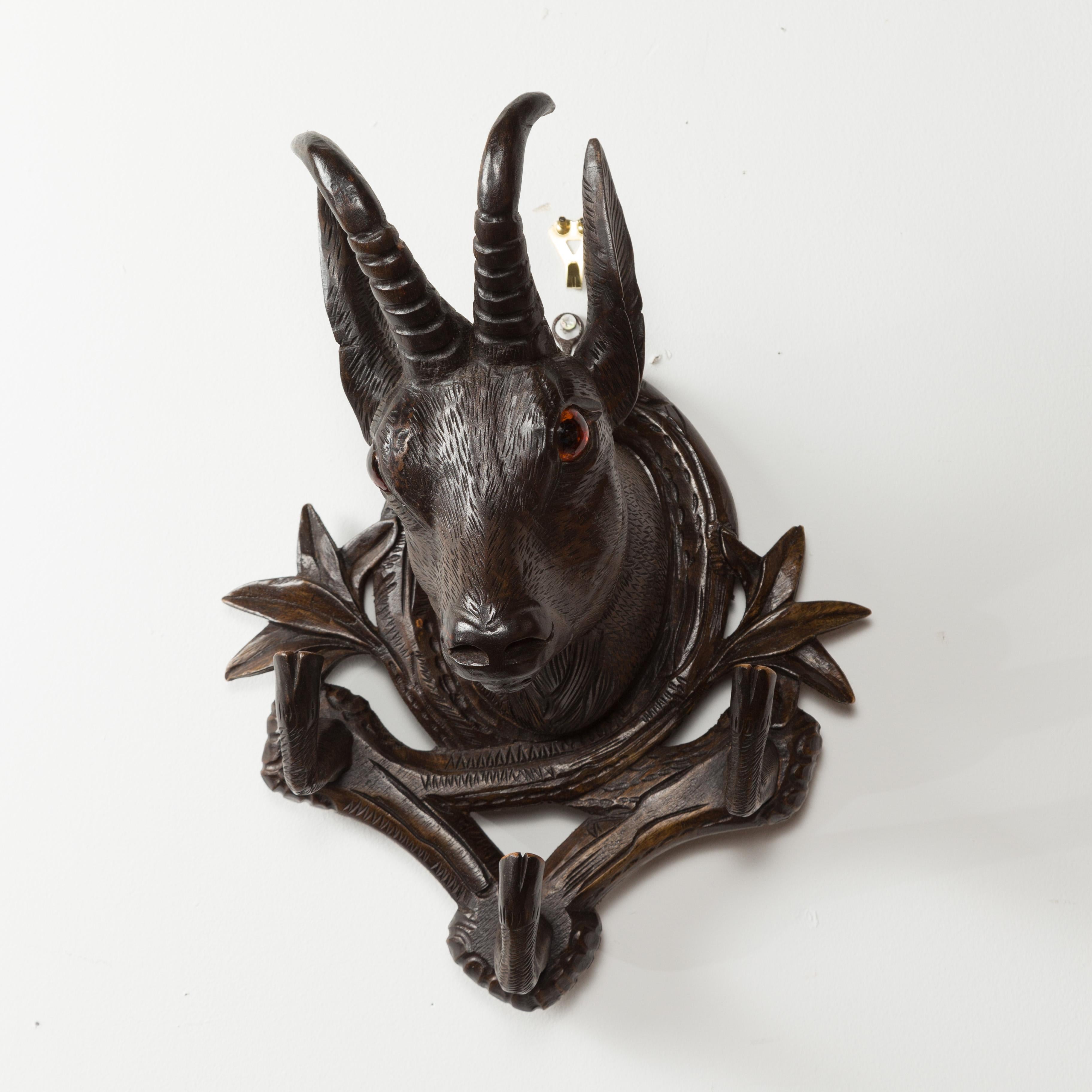 European Pair of Black Forest 1880s Carved Wooden Chamois Coat or Hat Racks with Foliage For Sale