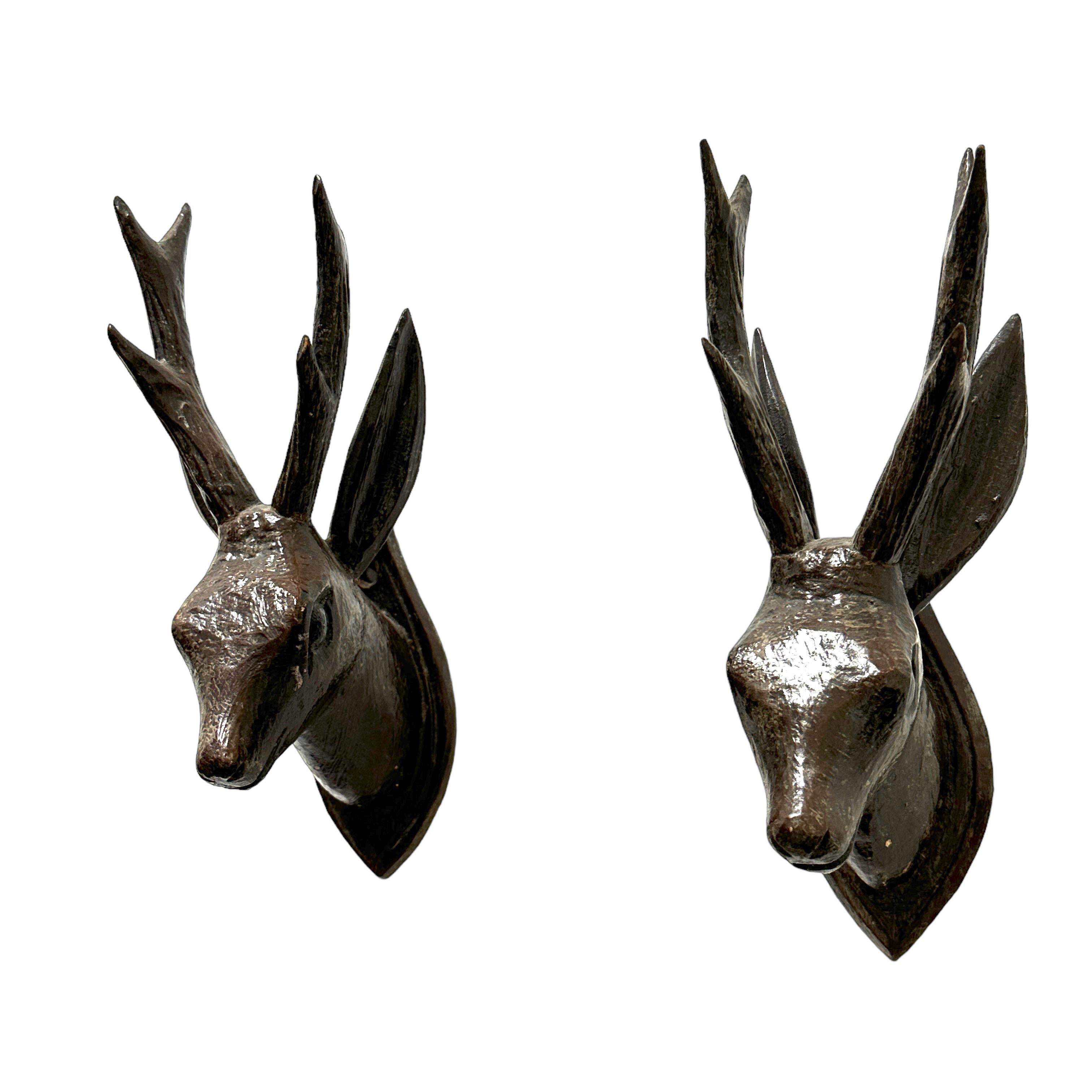 A great looking hand carved original wooden Folk Art pair of deer head wall decoration. A great piece for a suitable ambiance in a trophy room or the office of a Hunter or Woodsman. More than likely one of the Folk Art items made between 1860 and