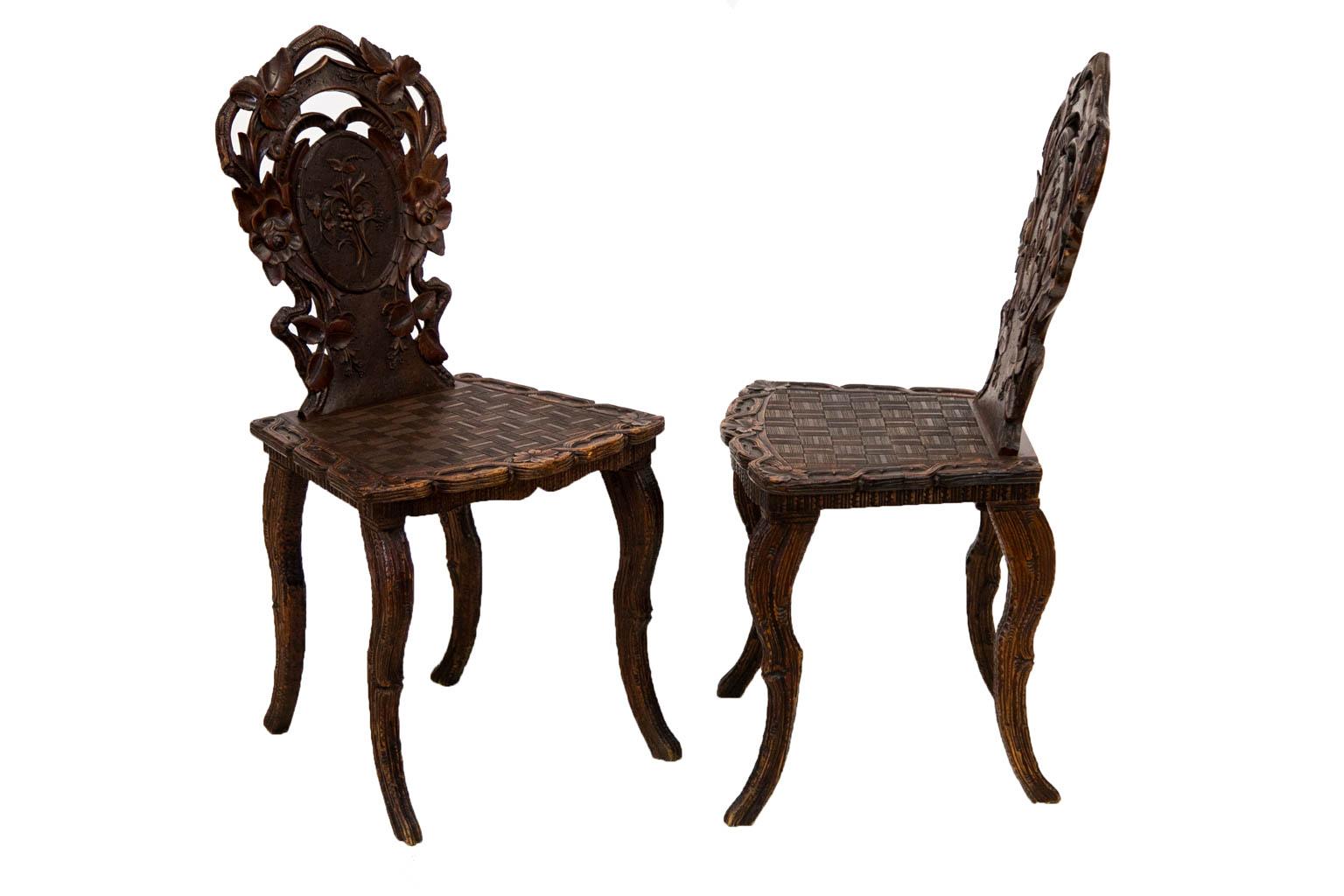 Carved Pair of Black Forest Hall Chairs For Sale