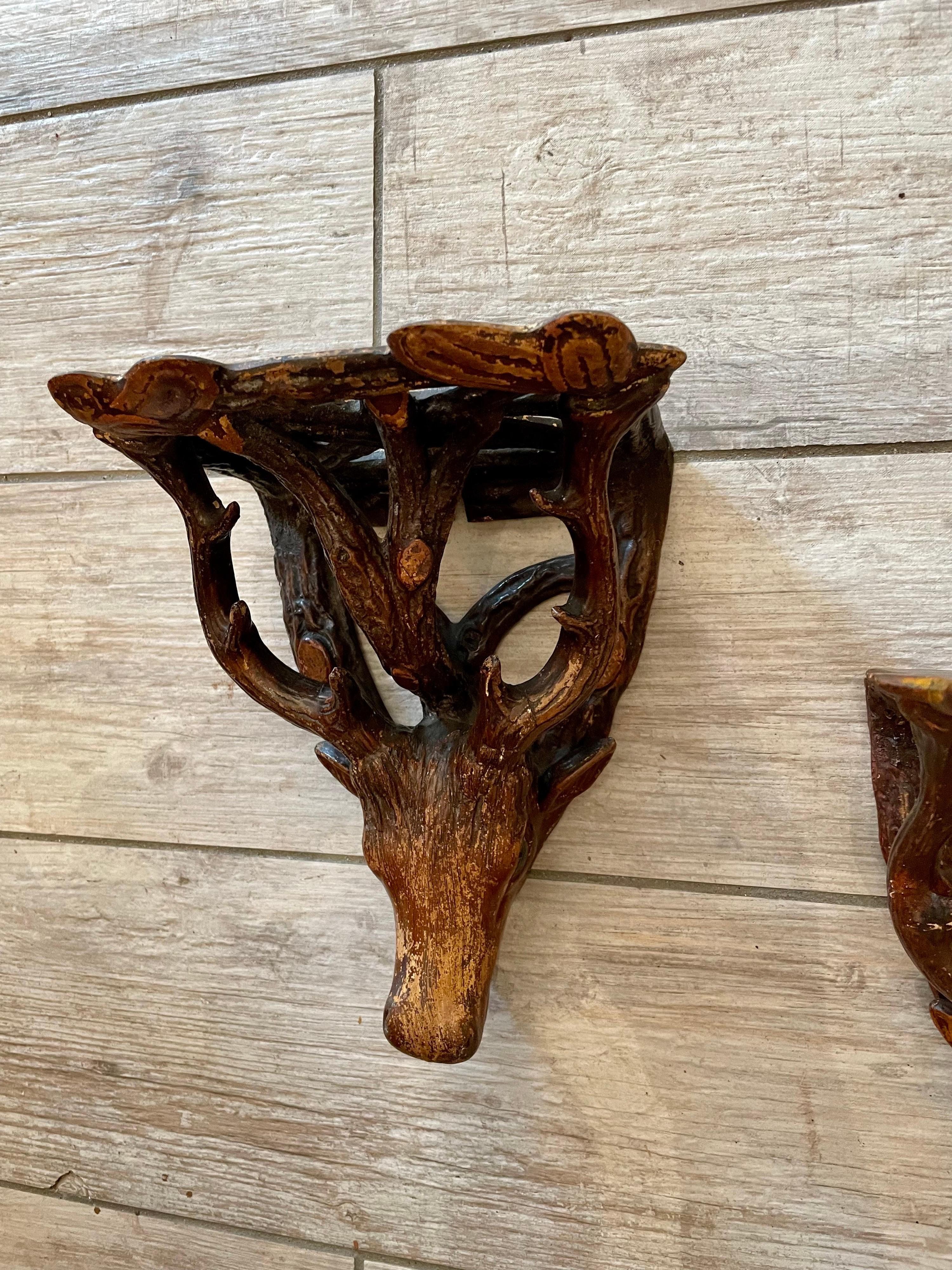 Pair of Black Forest style Deer head wall shelves or brackets. Made in a Faux Bois design.