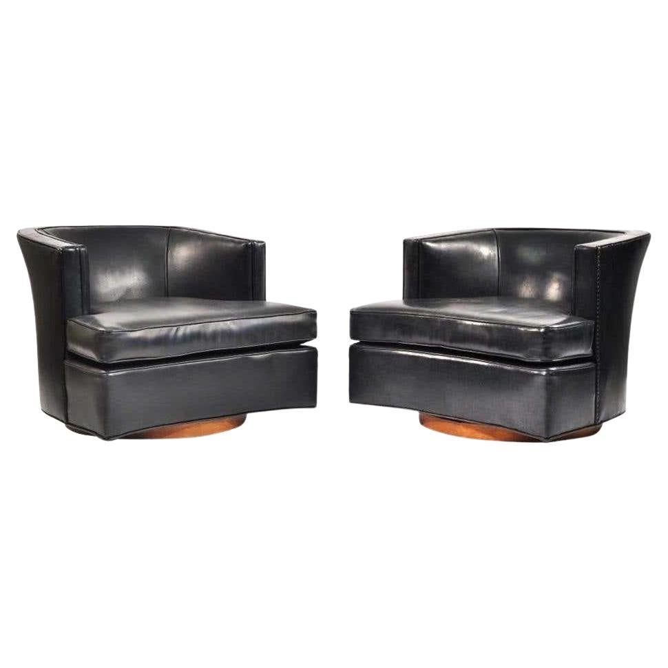 Pair of Black Leather Harvey Probber Swivel Lounge Chairs