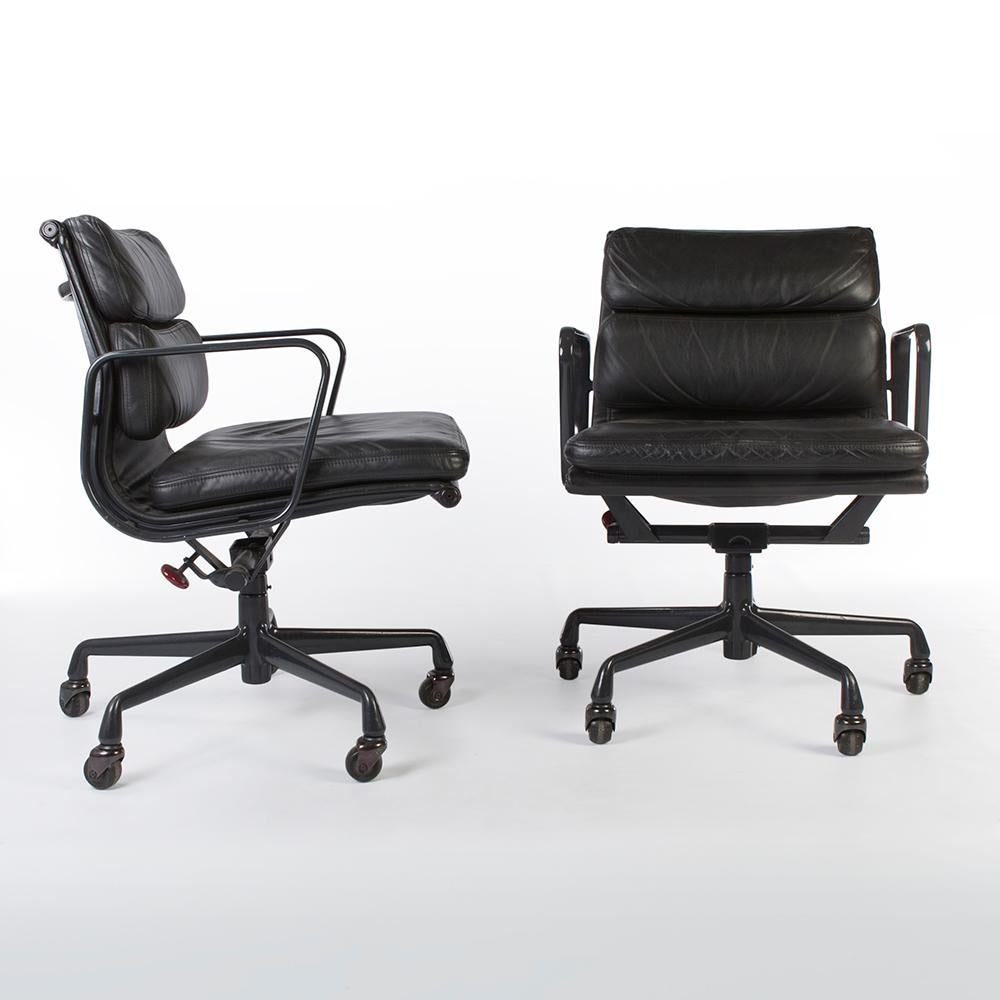 Quite possibly the perfect set of office chairs, this original Herman Miller Eames EA435 'Soft Pad' aluminium 'desk chair' is finished in gorgeous black leather and the frame is finished in the classic 'egg-plant' finish. Being a used piece, there