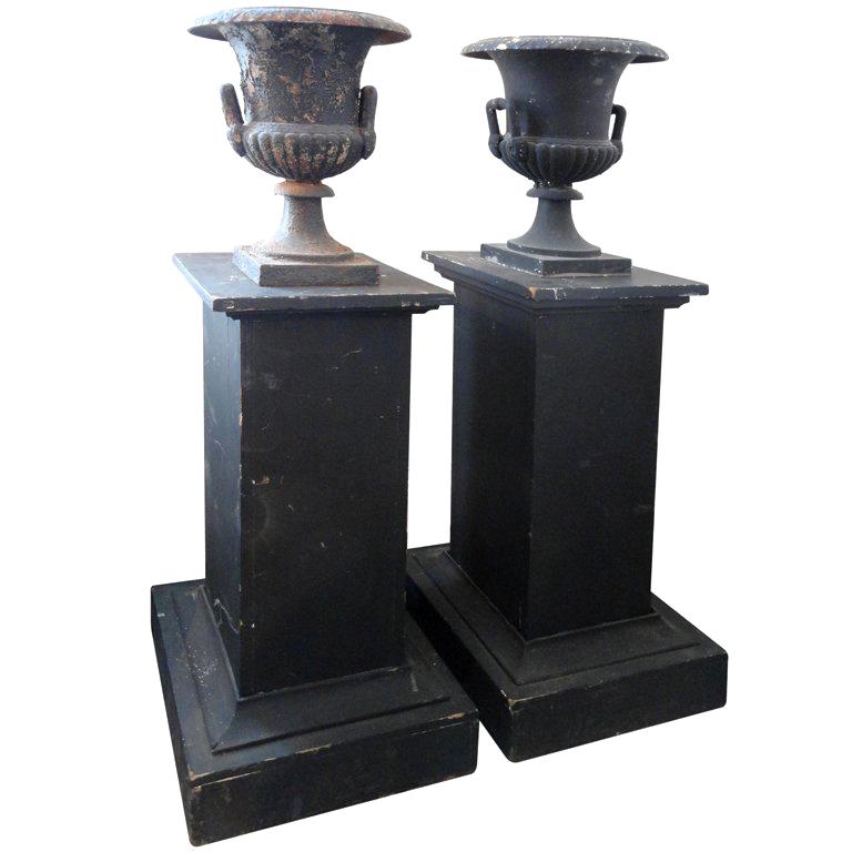 Pair of Black Iron Urns on Pedestals