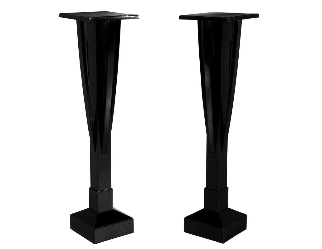 This pair of black lacquer art deco pedestal stands are a true representation of timeless elegance and sophistication. Crafted in the 1940’s in the United States, these stands have been meticulously restored to their former glory, boasting a high