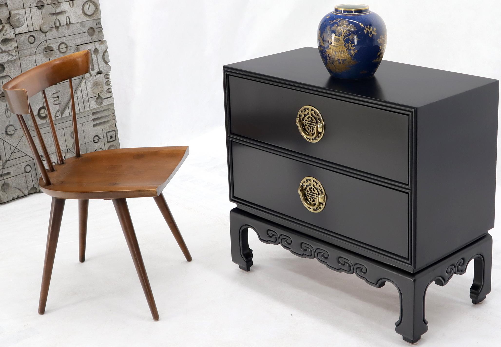 Pair of Mid-Century Modern high quality craftsmanship Asian influence two drawers side or end tables on bracket leg by Hekman.