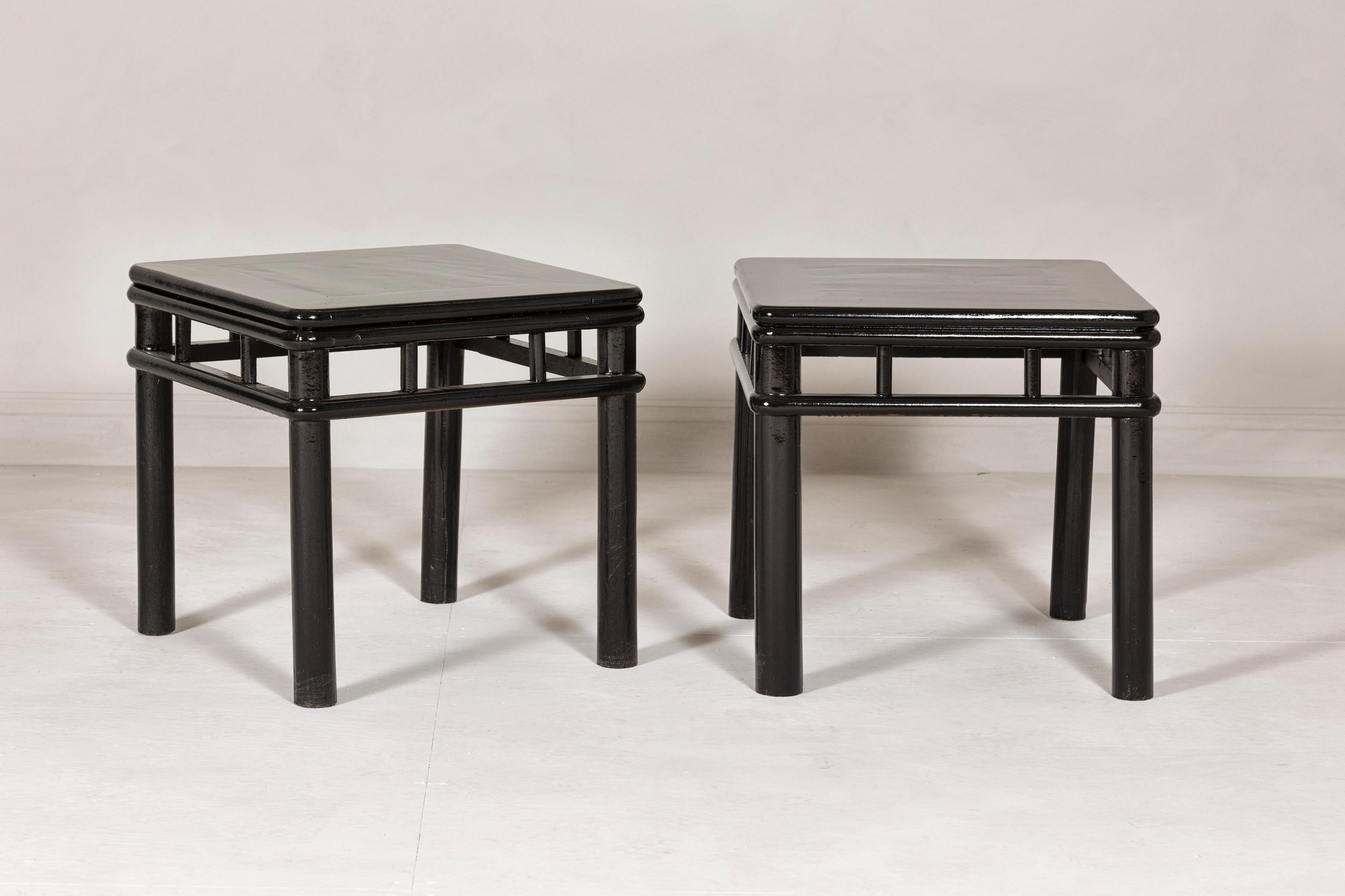 Pair of Black Lacquer Drinks Tables with Open Stretcher and Cylindrical Legs In Good Condition For Sale In Yonkers, NY