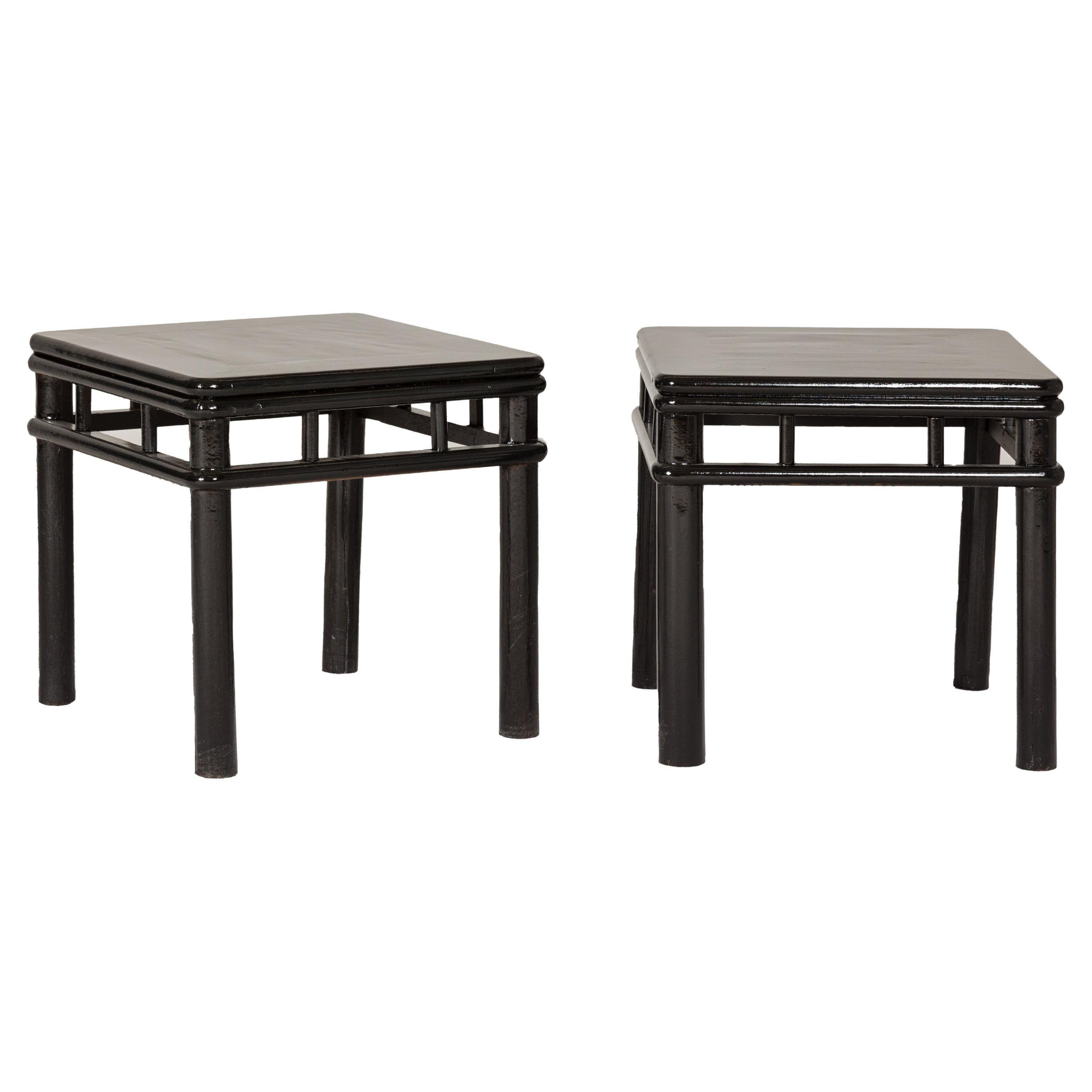 Pair of Black Lacquer Drinks Tables with Open Stretcher and Cylindrical Legs For Sale