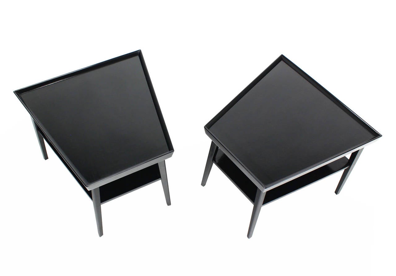 Pair of black lacquer trapezoid shape end tables stands. Restored condition.