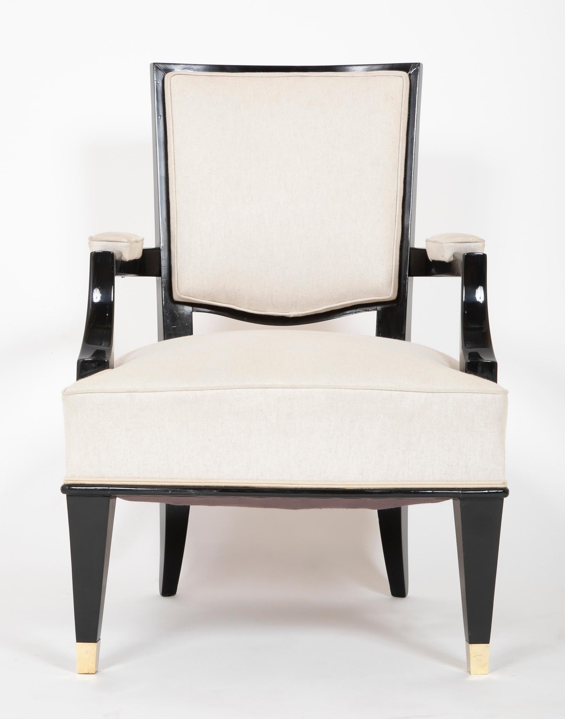 A pair of 1930's French armchairs newly reupholstered in Rogers and Goffigon fabric and Bronze sabot. In the manner of Andre Arbus.