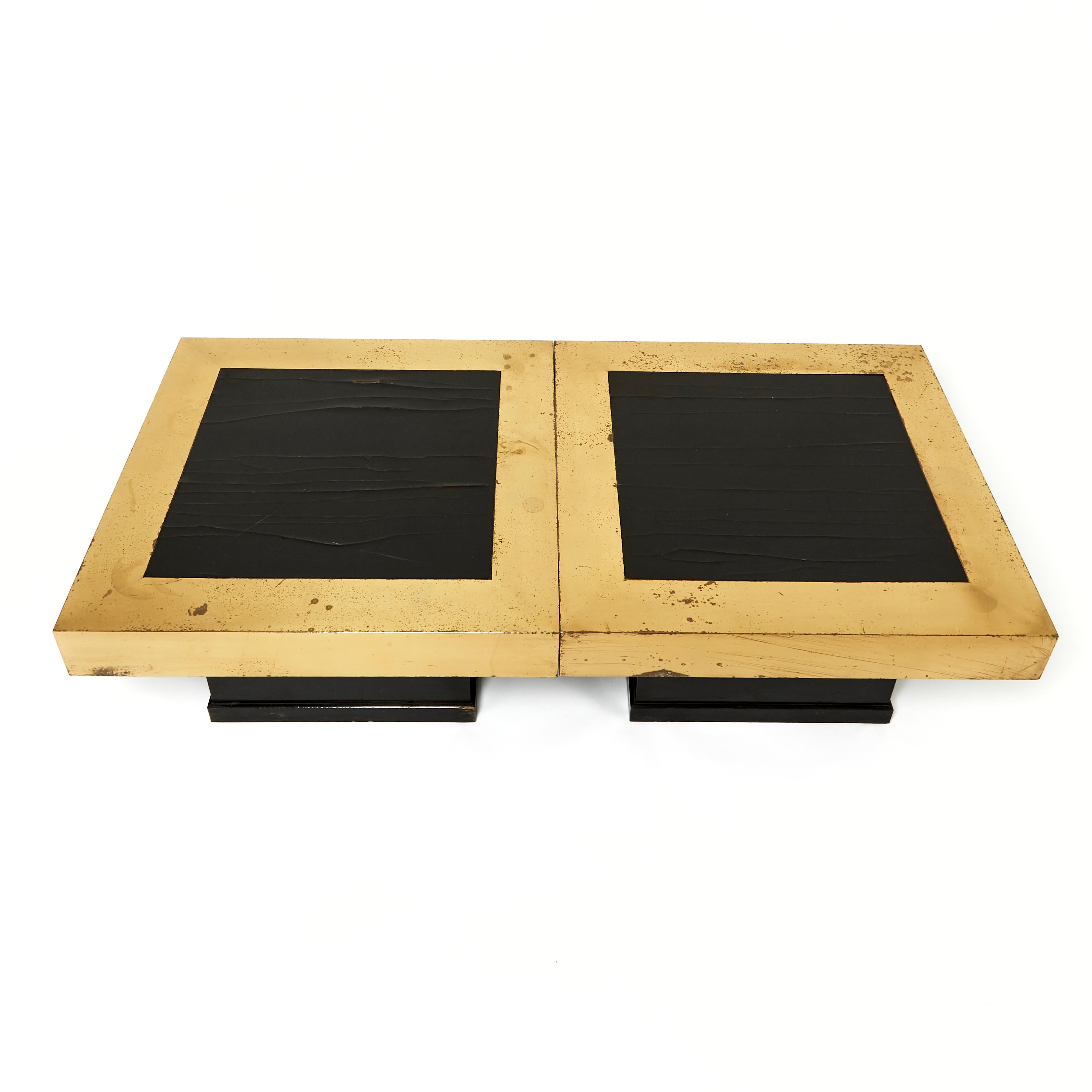This pair of naturally aged black lacquer coffee tables have wide brass borders and are square in shape. The brass and tops do display some wear, and are shown in the images but the tables are structurally sound. Each one measures: 25 ¾ in, 65.4 cm
