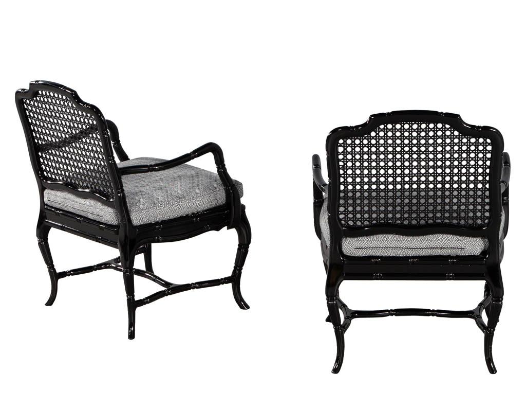 Mid-20th Century Pair of Black Lacquered Cane Back Lounge Chairs For Sale