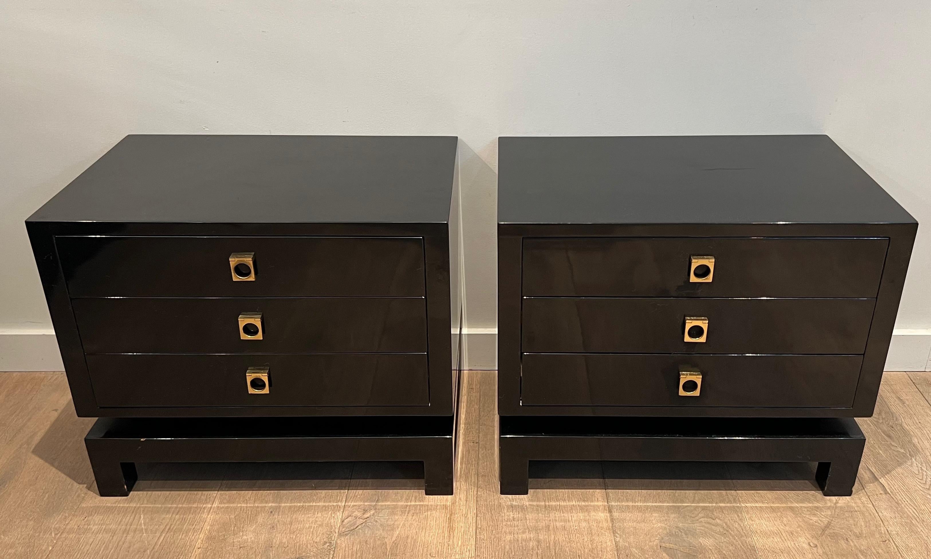 This very nice and rare pair of drawers side tables is made of black lacquered wood with bronze handles. The quality is very fine and the design typical of the famous French designer Guy Lefèvre for Maison Jansen, circa 1970.