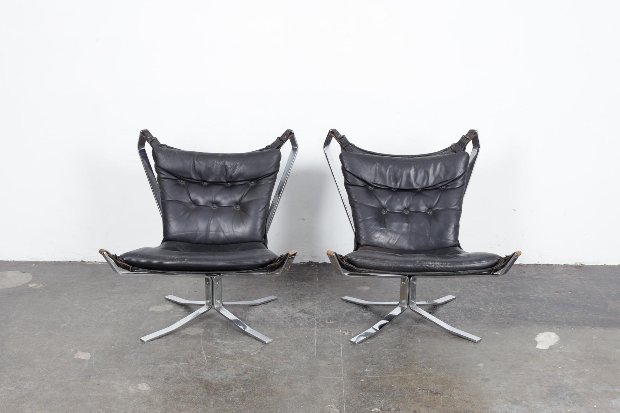 A pair of Danish chrome flat bar metal and black leather sling chair, in the manner of the Falcon chair, 1960s. Sold as a pair or separately.  