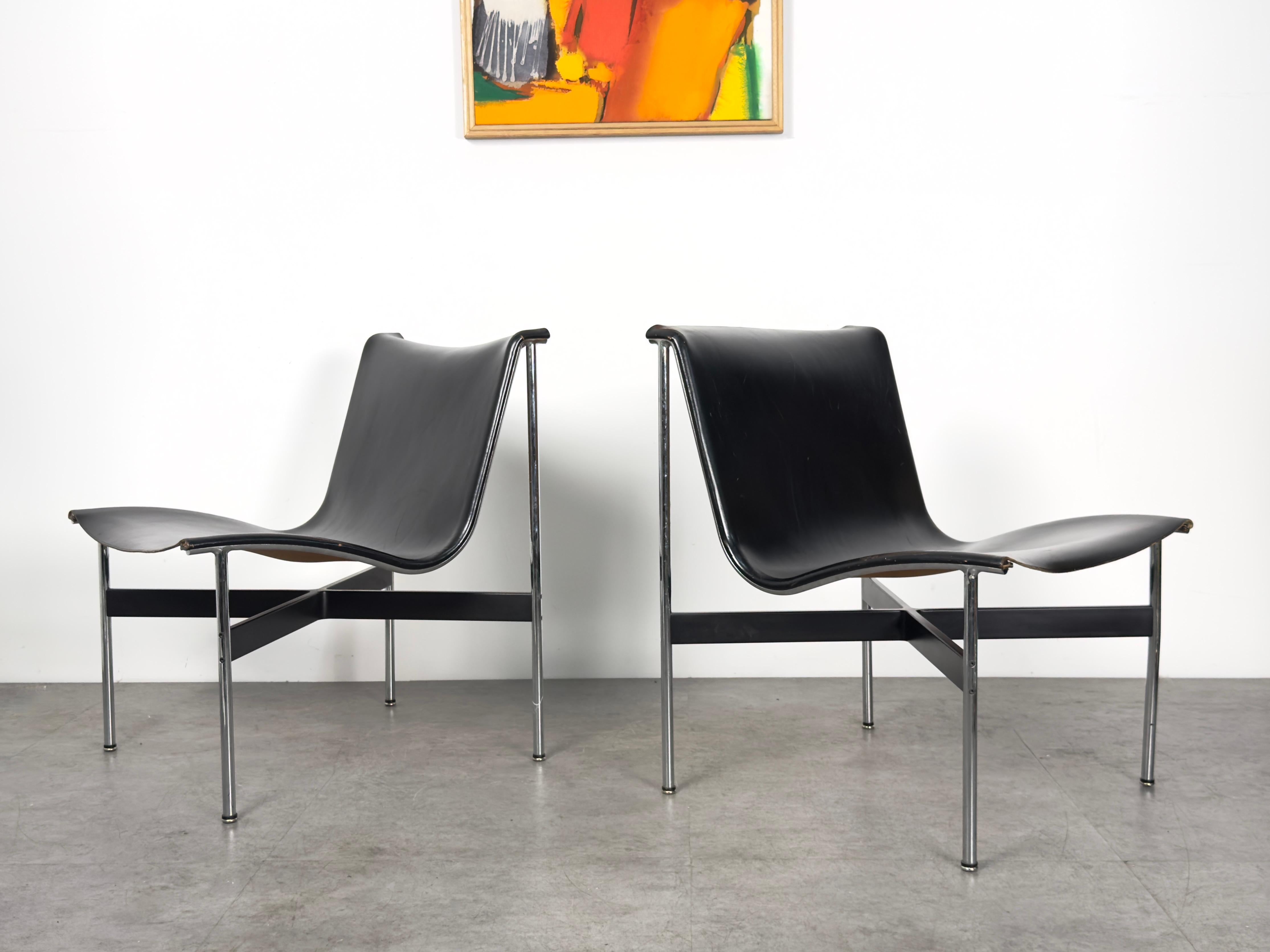 A pair of New York lounge chairs designed by Douglas Kelly, Ross Littell and William Katavolos for Laverne International 

Circa 1960s

Architectural chrome plated steel frames with black X stretcher and original black leather sling seats 

23 inch