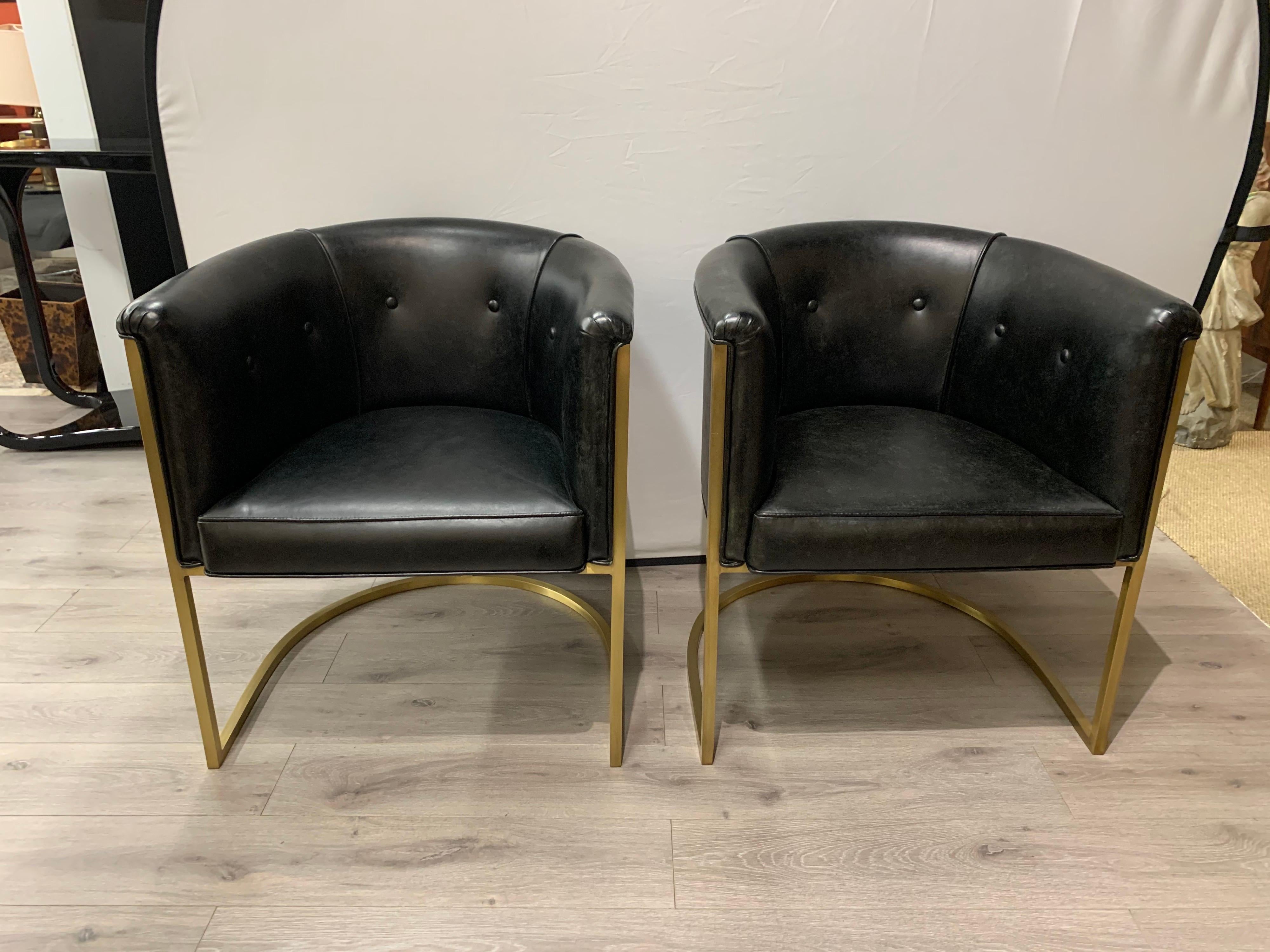 Elegant, midcentury style gold and black curved barrel back chairs. They have the coveted Milo Baughman styled lines and golden steel frame that envelopes the back. Great condition. Now, more than ever, home is where the heart is.