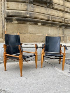 Pair of Black Leather and Oak Wilhelm Kienzle Safari Chairs