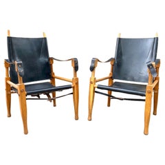 Pair of Black Leather and Oak Wilhelm Kienzle Safari Chairs
