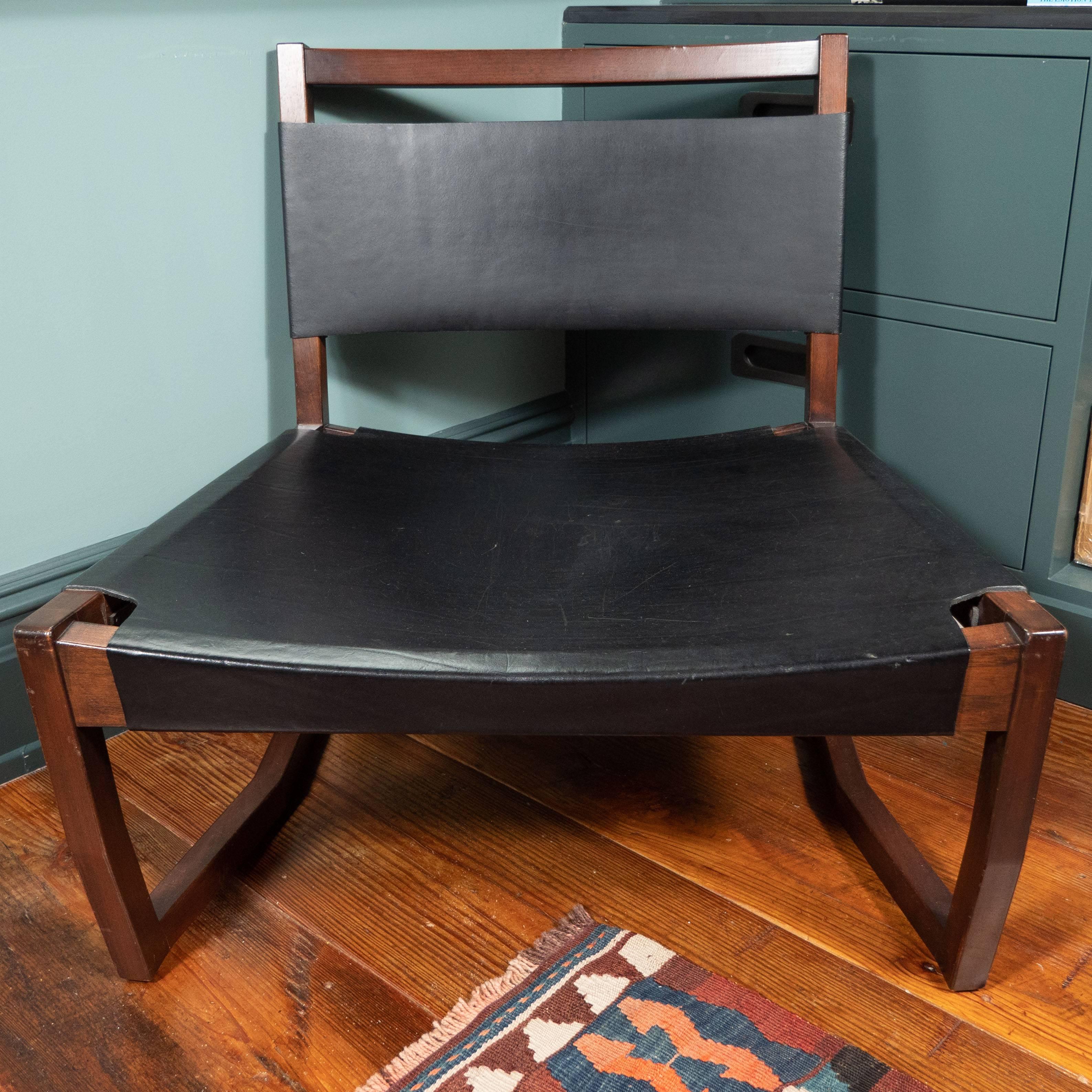 Pair of black leather and rosewood sling chairs.

Measures: Seat width (Front) 29