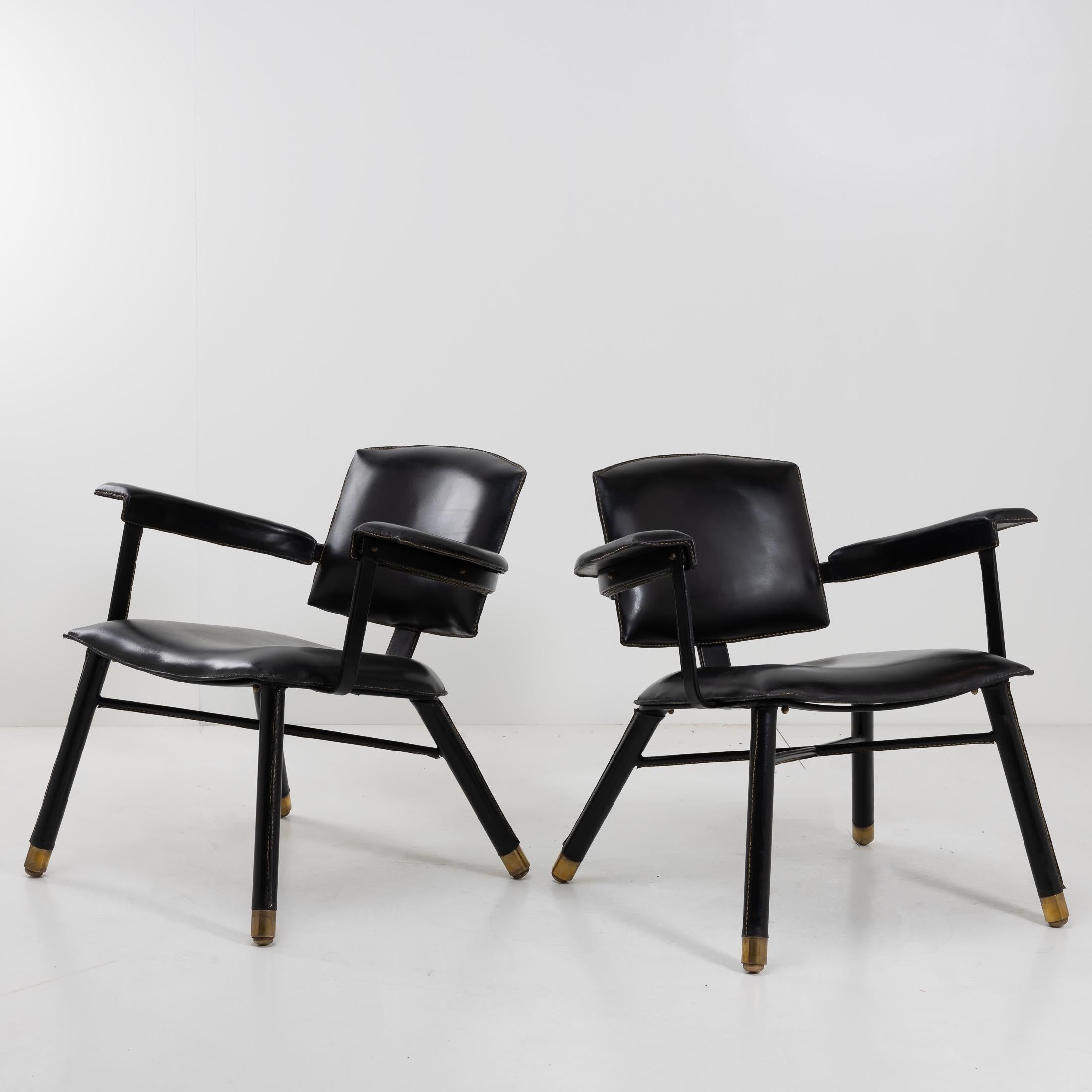 About this pair of black leather armchairs by Jacques Adnet
Pair of 