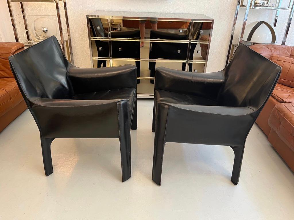 Pair of early Cab 414 lounge chairs, black high quality leather zippered over the steel frame.
Beautiful patina. Signed Cassina under the seat ( picture )
Very comfortable chairs.