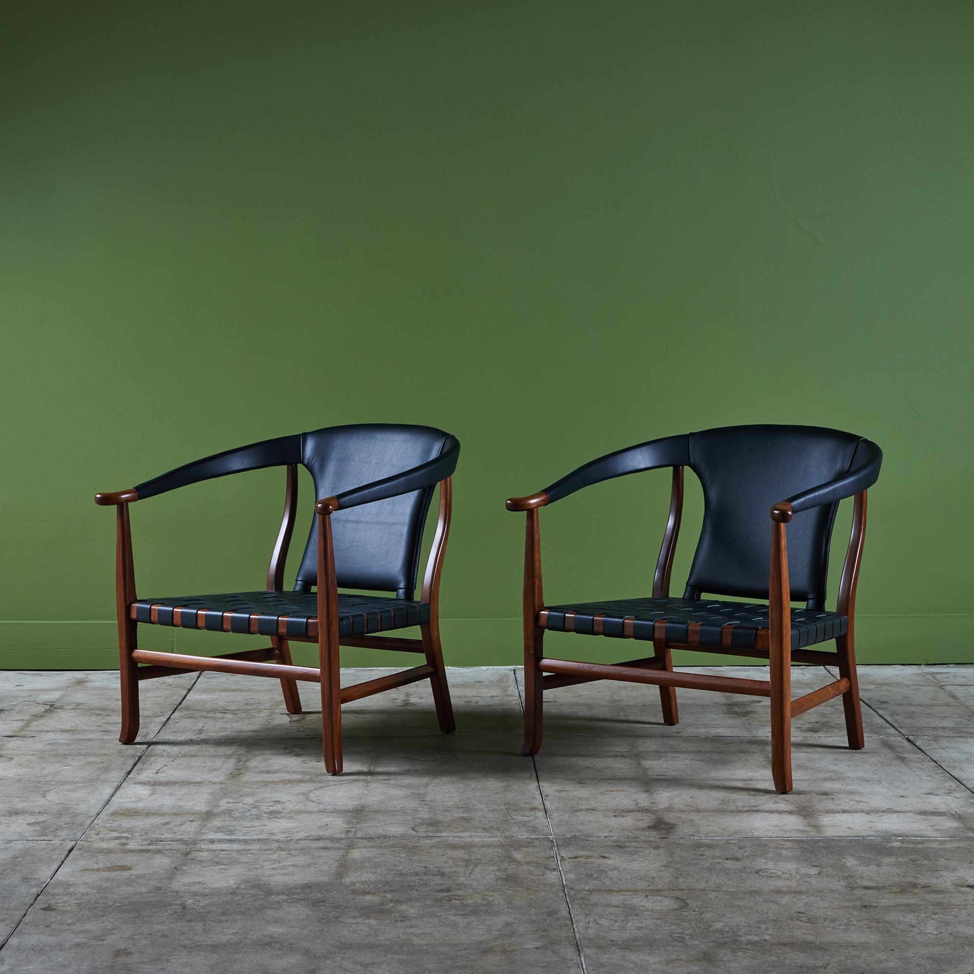 An eye catching pair of lounge chairs for Glenn of California, c.1960s. These armchairs feature a rich toned walnut frame with woven black leather seats and black leather wrapped arm and backrests.

Dimensions 
28.5