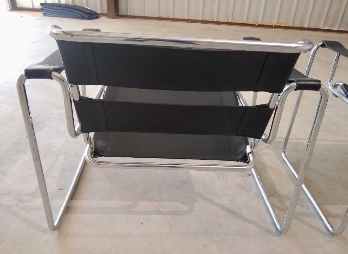 Iconic Marcel Breuer style black leather Wassily chairs, circa 1980s. Made in Italy.
There are no manufacturer hallmarks. The leather and chrome is in great pre-owned condition
especially given their age. In spirit and stature, the Wassily chair