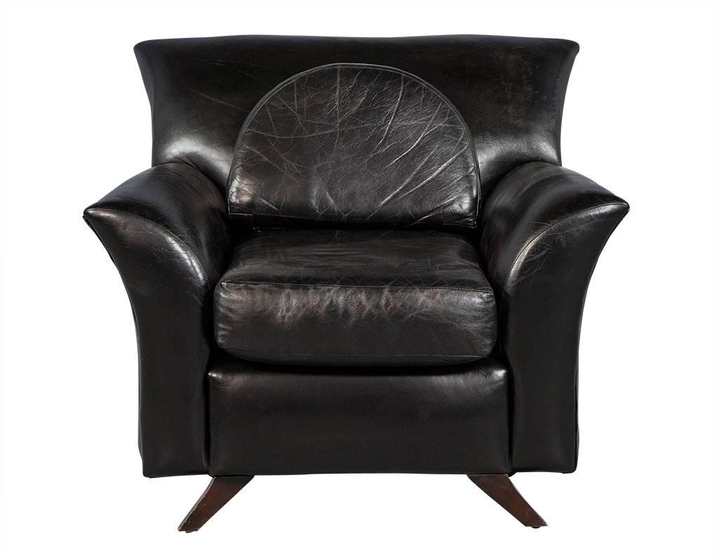 These modern parlor chairs are just luxurious.  Each is upholstered in distressed black leather with semi-circle backrest pillows.  They sit atop dark brown angled, tapered legs and are perfect for a well-appointed living room!