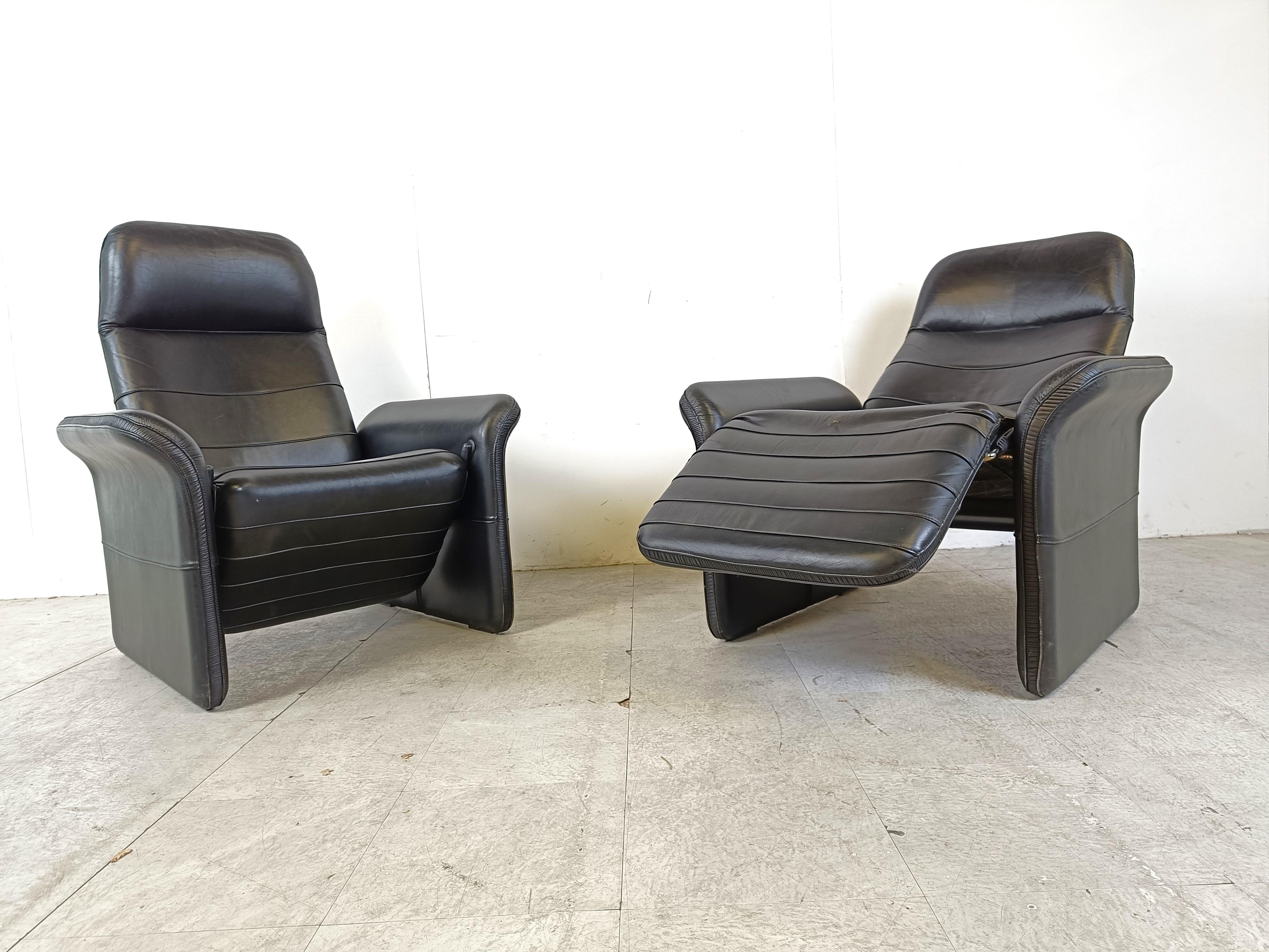 Swiss Pair of black leather reclining armchairs, 1970s  For Sale